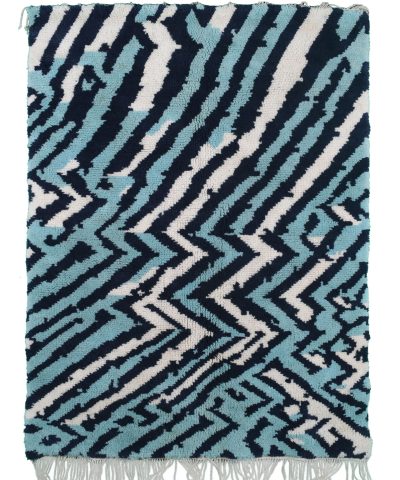 a blue and white rug with fringes. ANM02_W-40_BL-01_BL-09 (1.1)