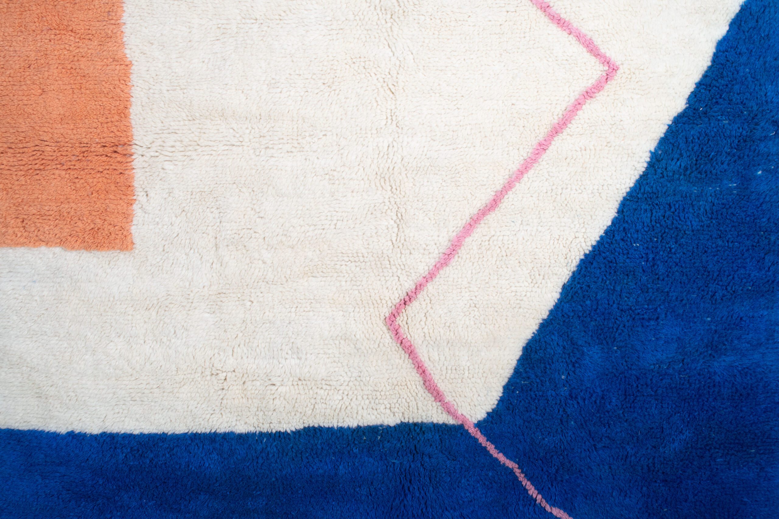 a blue rug with a pink and white design. VIN071_W-40_OR-26_BL-03_PN-92 (2)