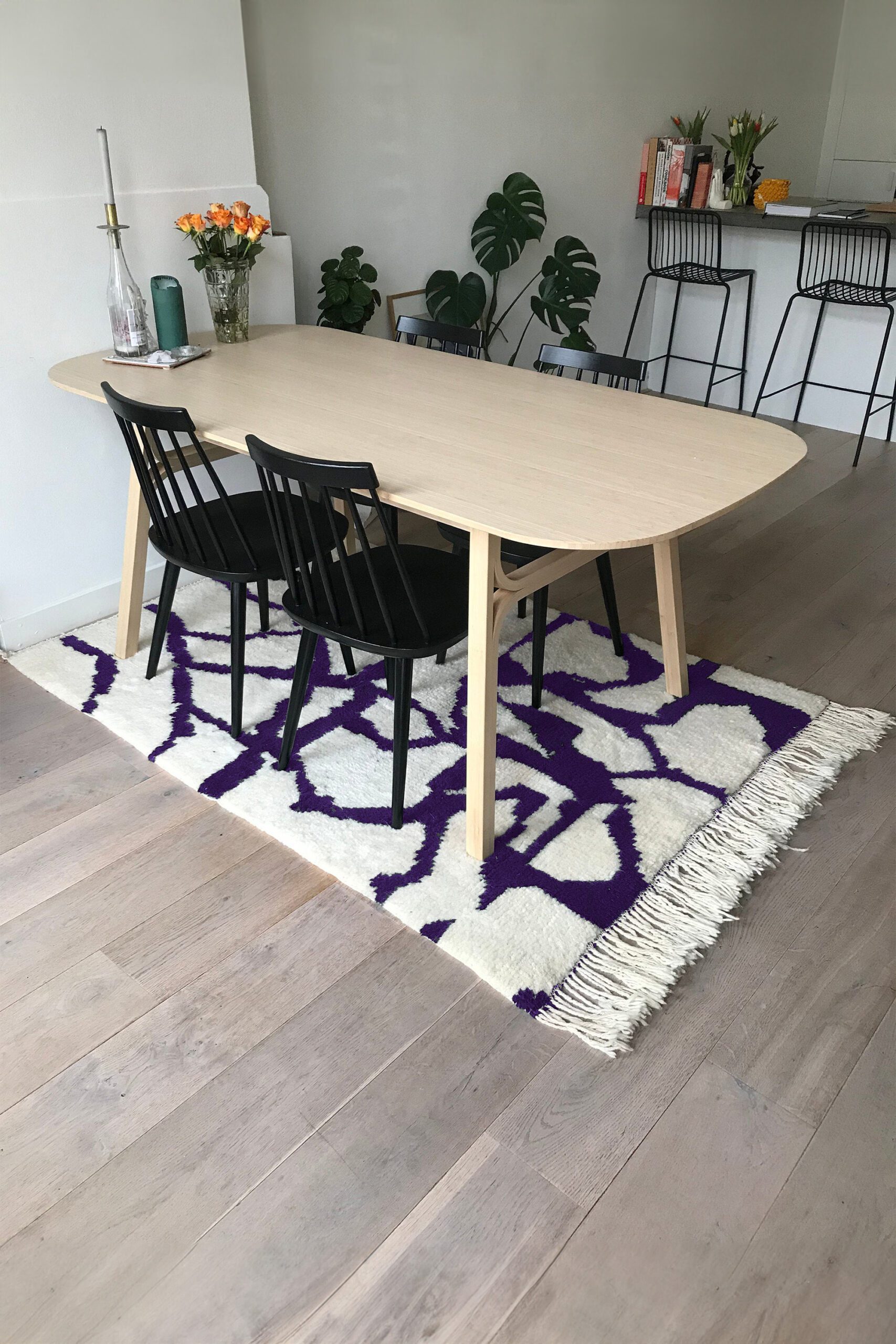 a dining table with chairs and a rug. VINX06_W-40_PR-19