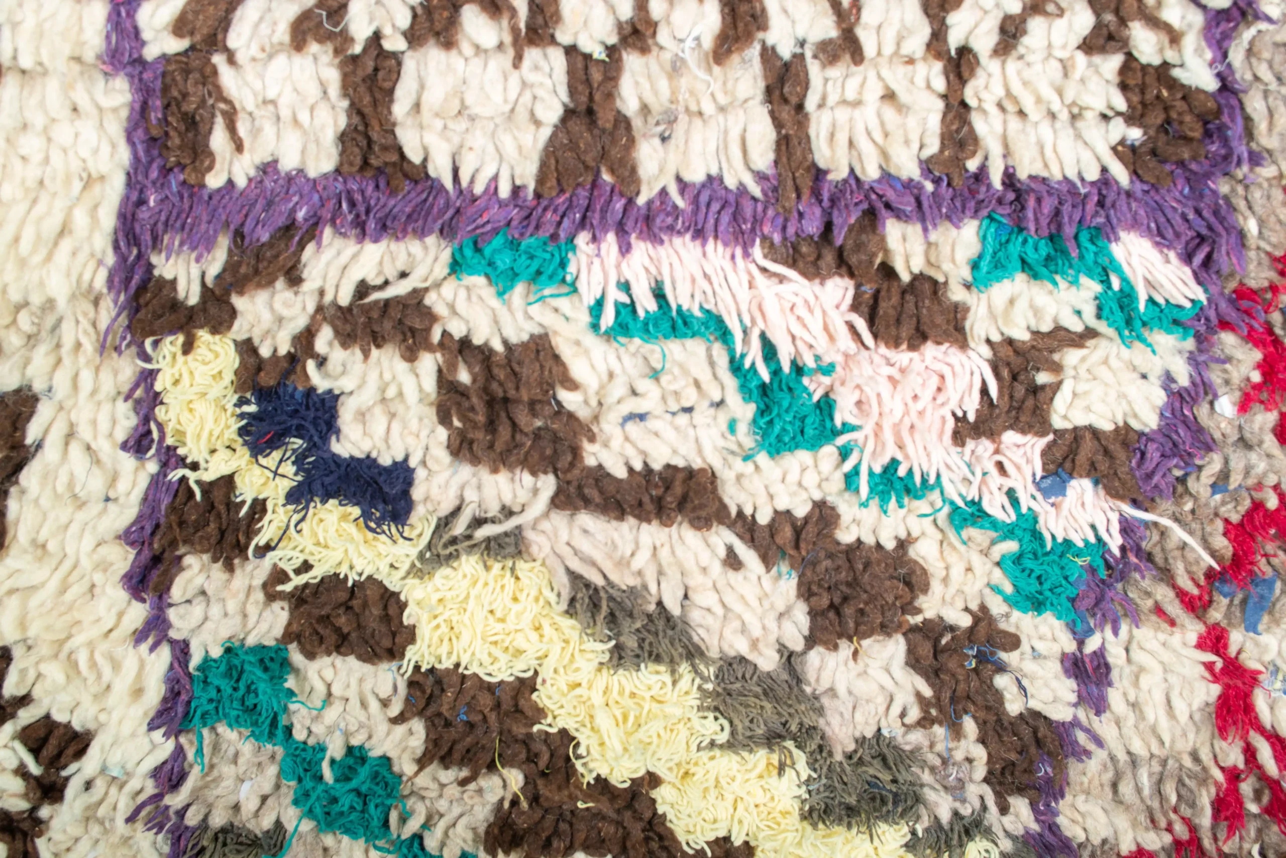 a pile of multi colored rugs. AZL-005_W-40_195-098 (5)