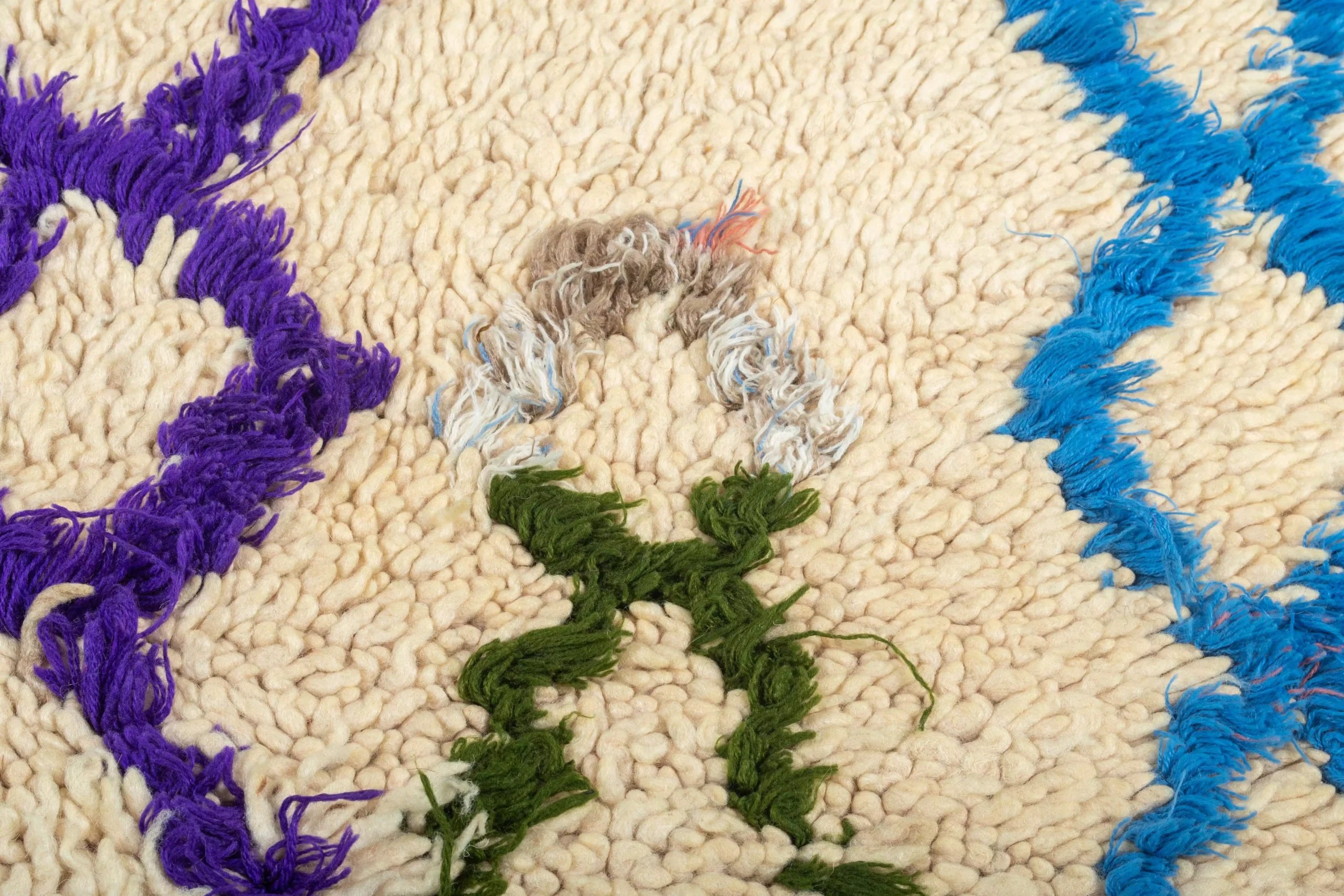 a cat laying on a rug with a toy. AZL-023_W-40_183-071 (8)