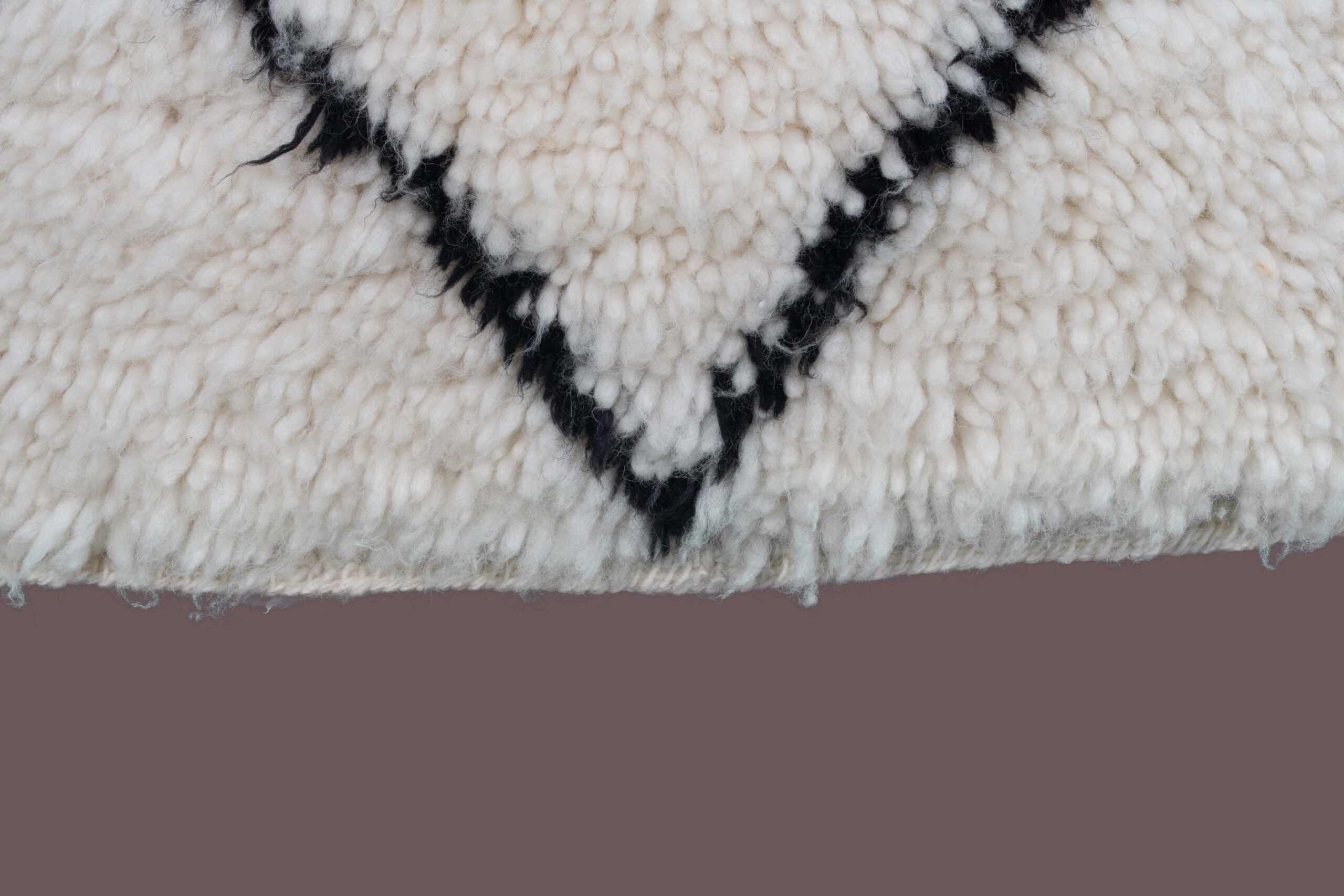 a white and black rug with a black and white design. BNO-013_W-40_BK_138-067 (8)