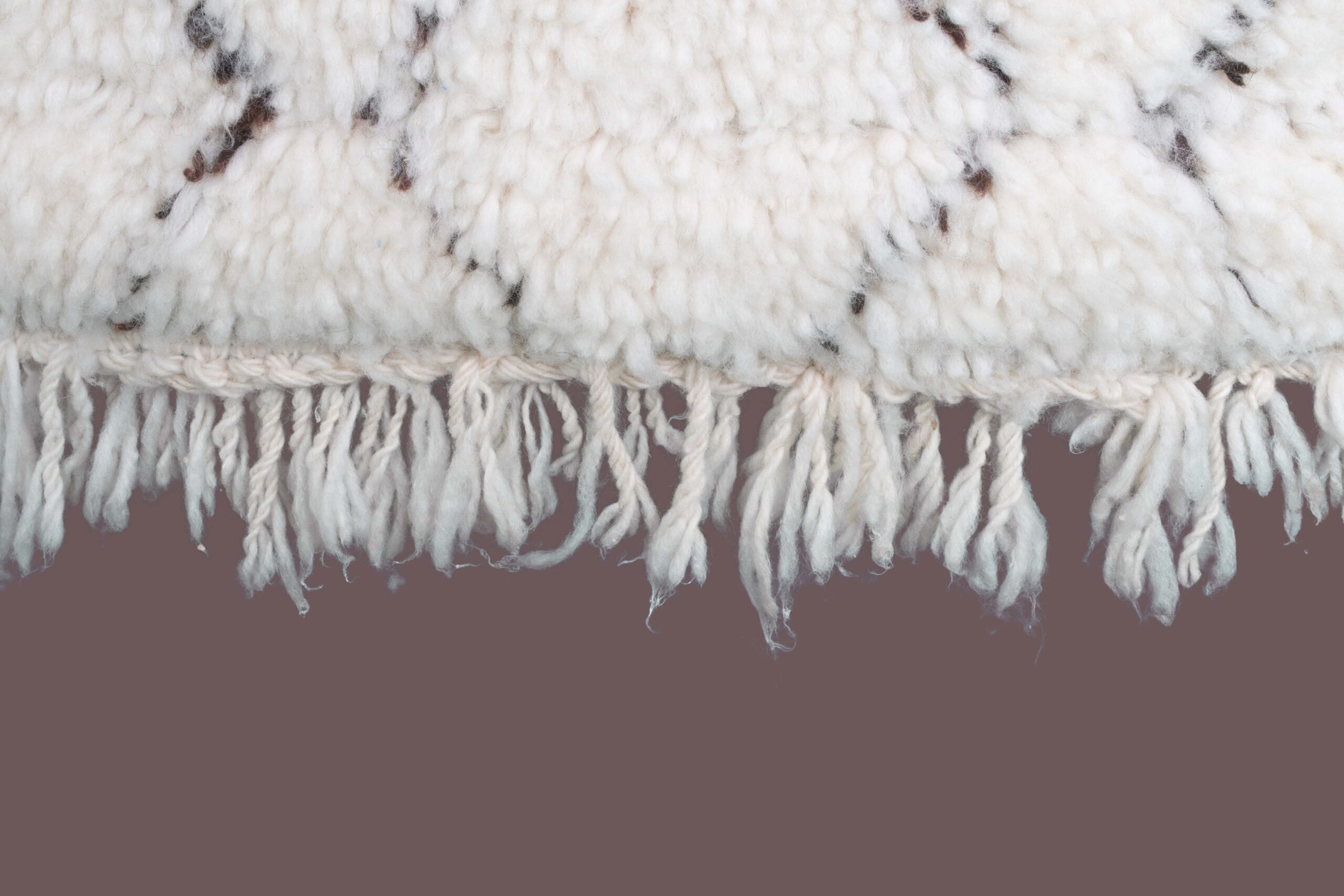 a white sheep rug with a black and white pattern. BNO-017_W-40_BK_124-070 (8)