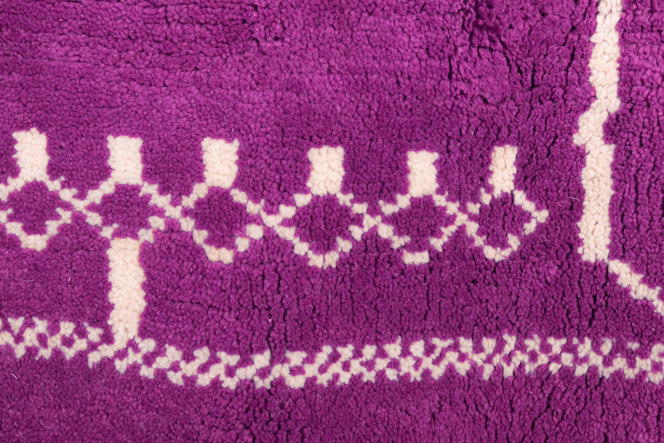 a purple rug with white and white designs. VIN0183_PN-33_W-40 (8)