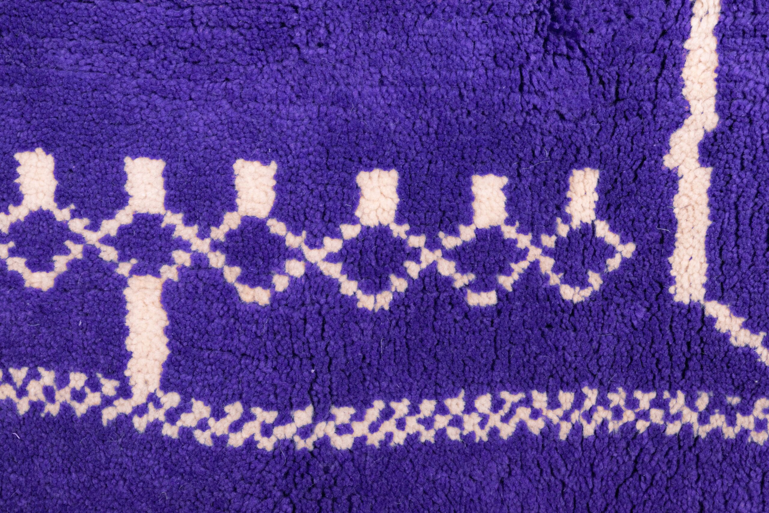 a purple rug with white and white designs. VIN0183_PR-19_W-40 (8)