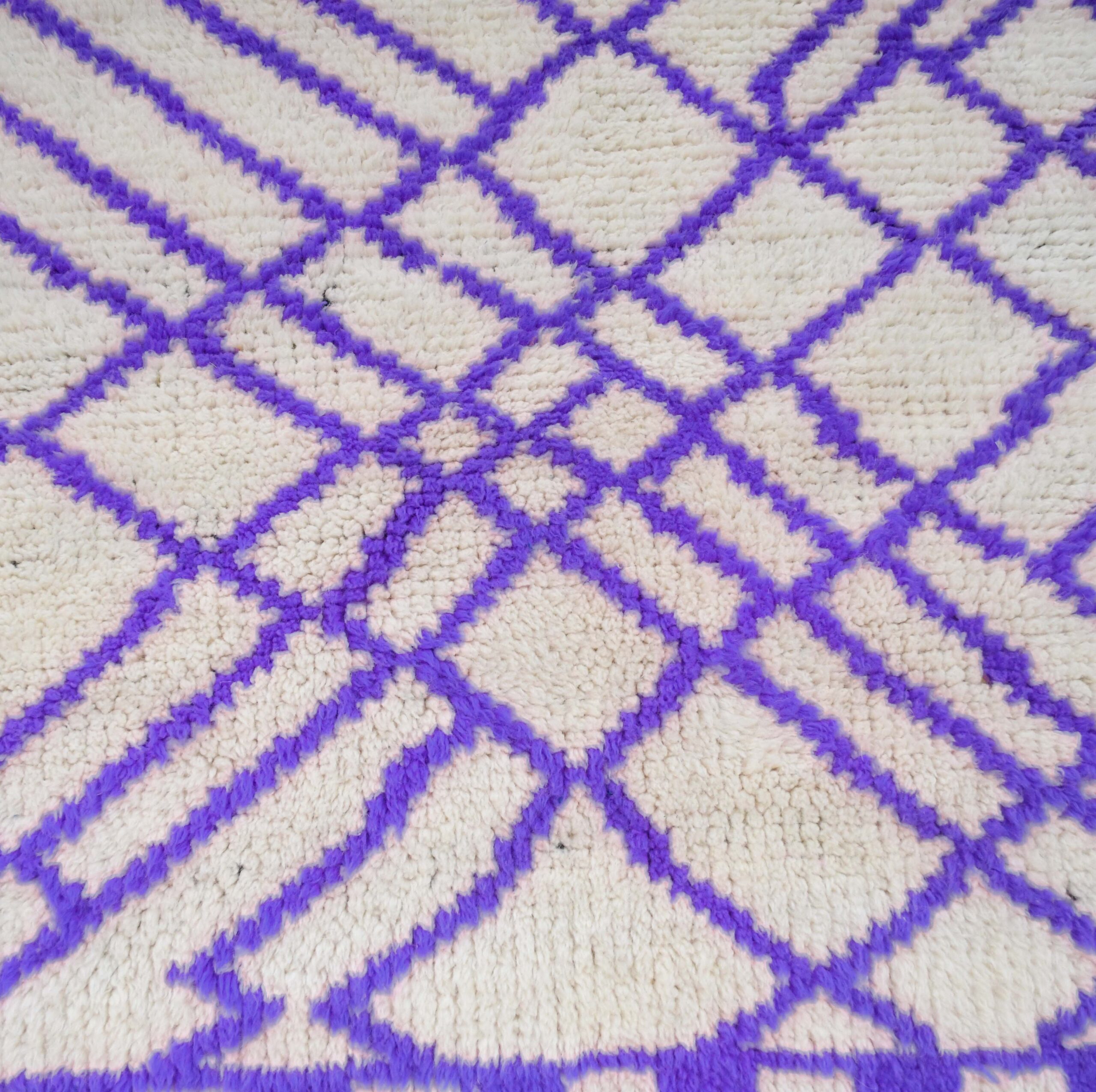 a purple and white rug with a pattern. VIN311_W-40_PR-19_BK-39_GR-13_03