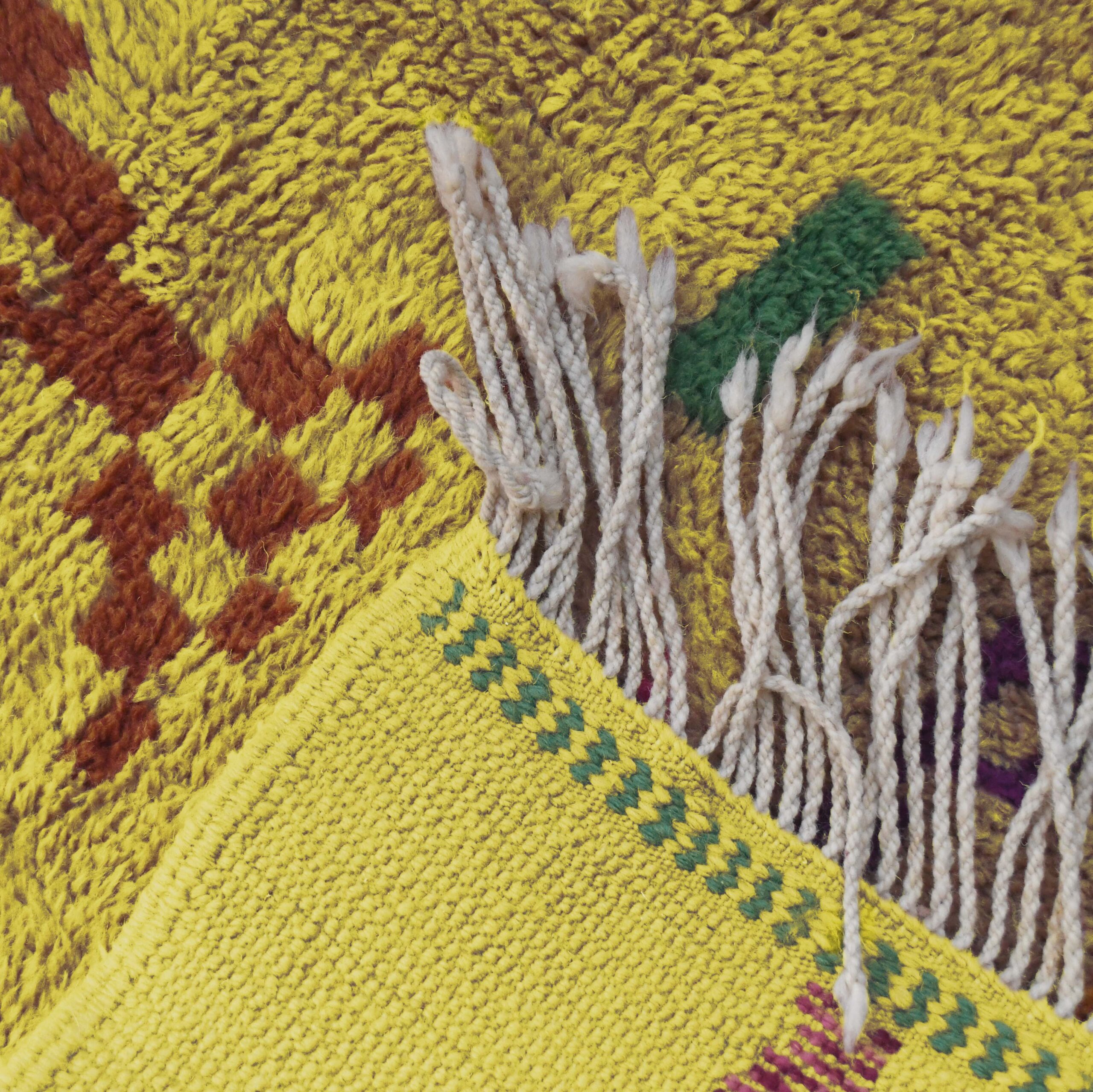 a yellow moroccan rug with a red and green design. VIN312_YL-15_GR2-97_GR-11_OR-24_PN-35_PN-33_BL-09_BR-302_BR-32_BR-28_PR-19_GY_37_BK-39_06