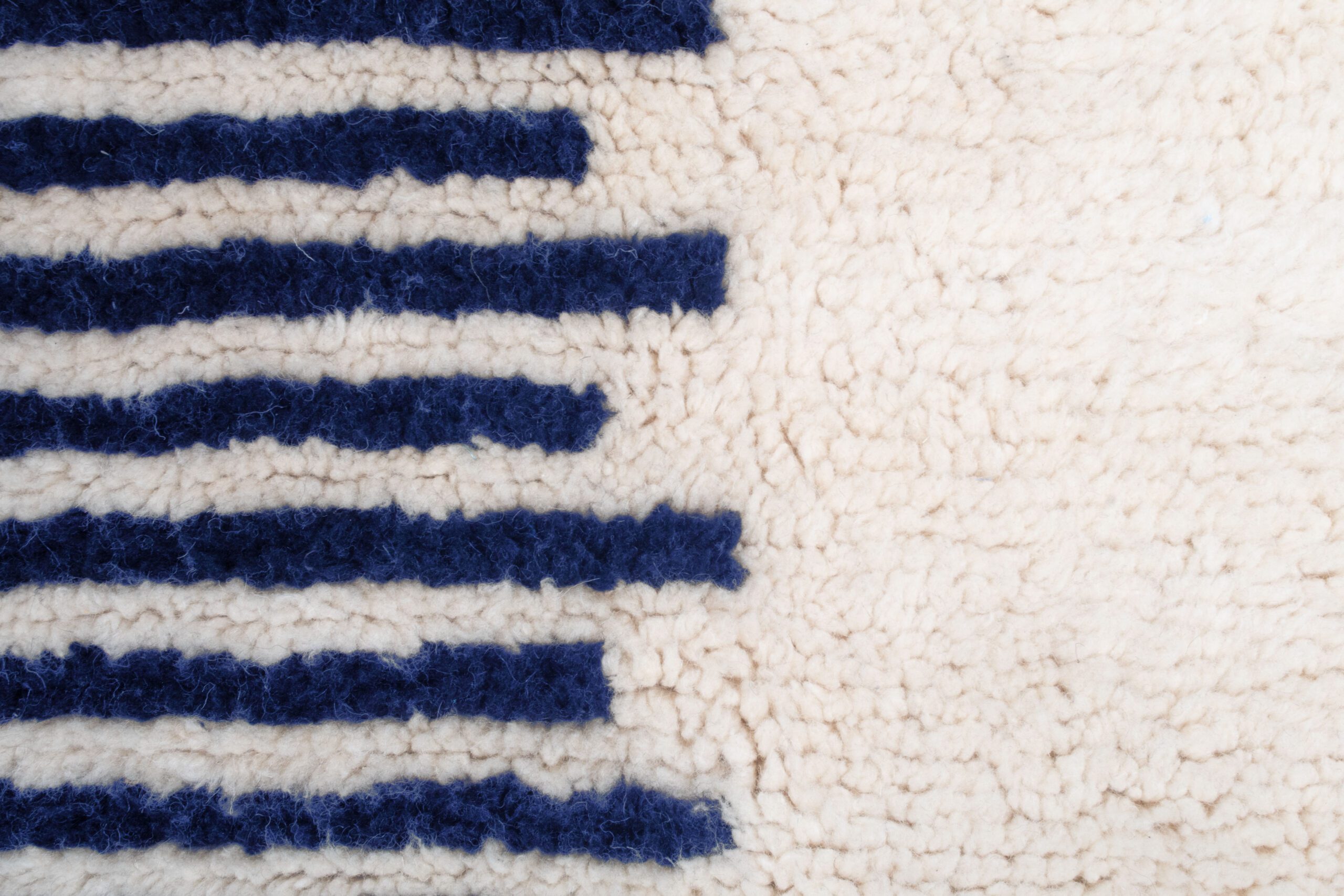 a close up of a rug with a blue stripe. VINA034-W-40_BL-01 (7)