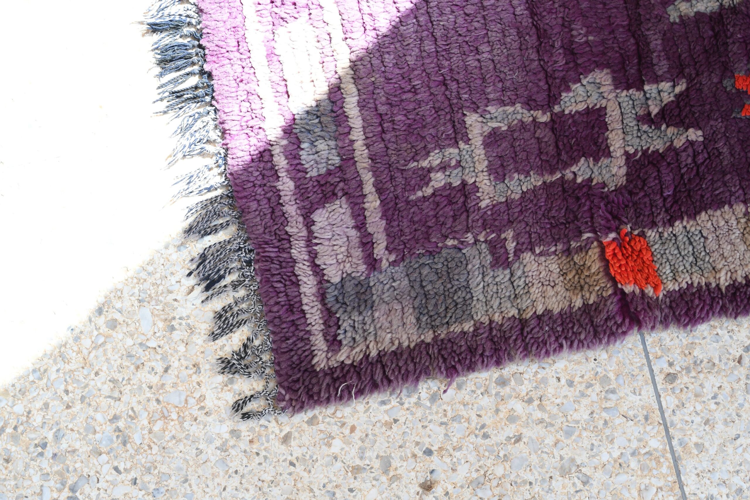 a purple rug with a red flower on it. il_fullxfull.6017180642_9on6.jpg