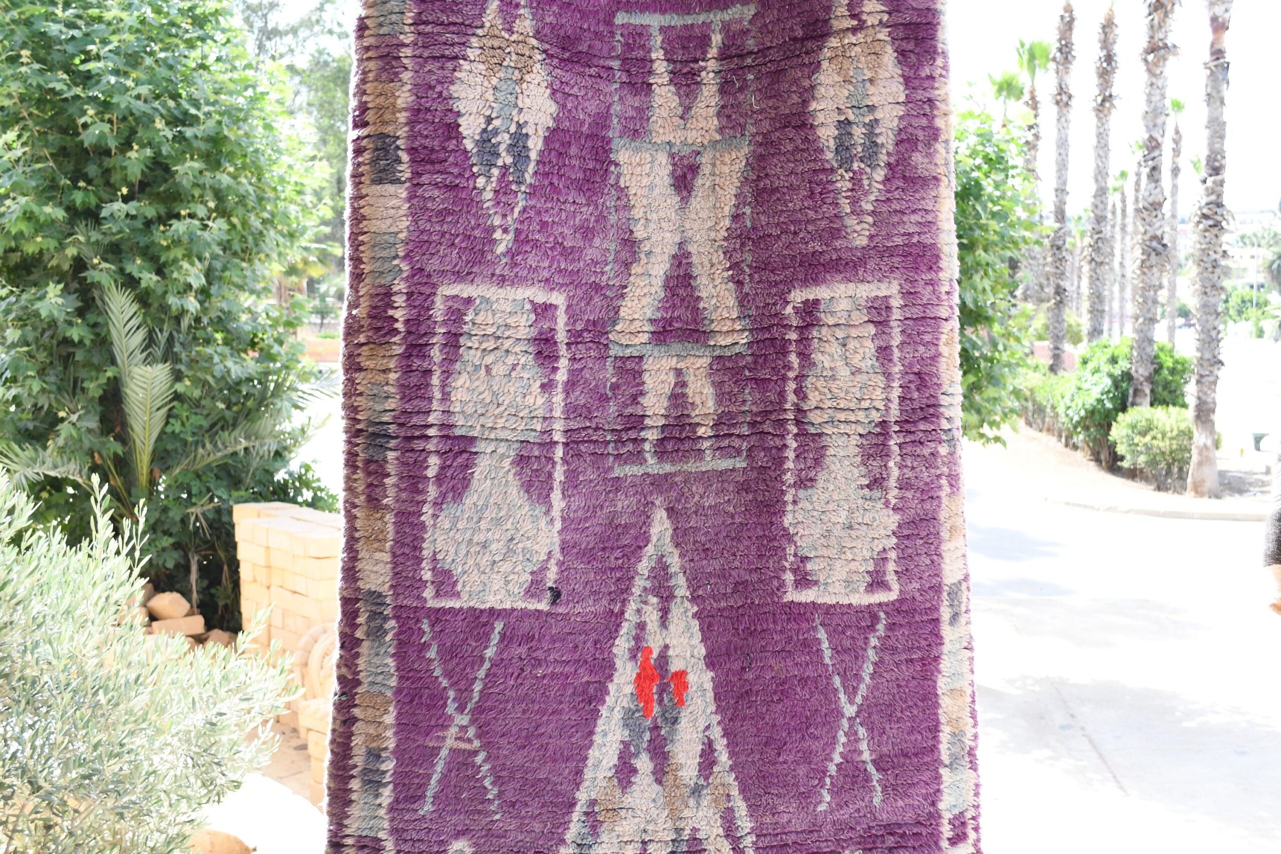 a purple rug hanging on a pole. il_fullxfull.6017181050_rz60.jpg