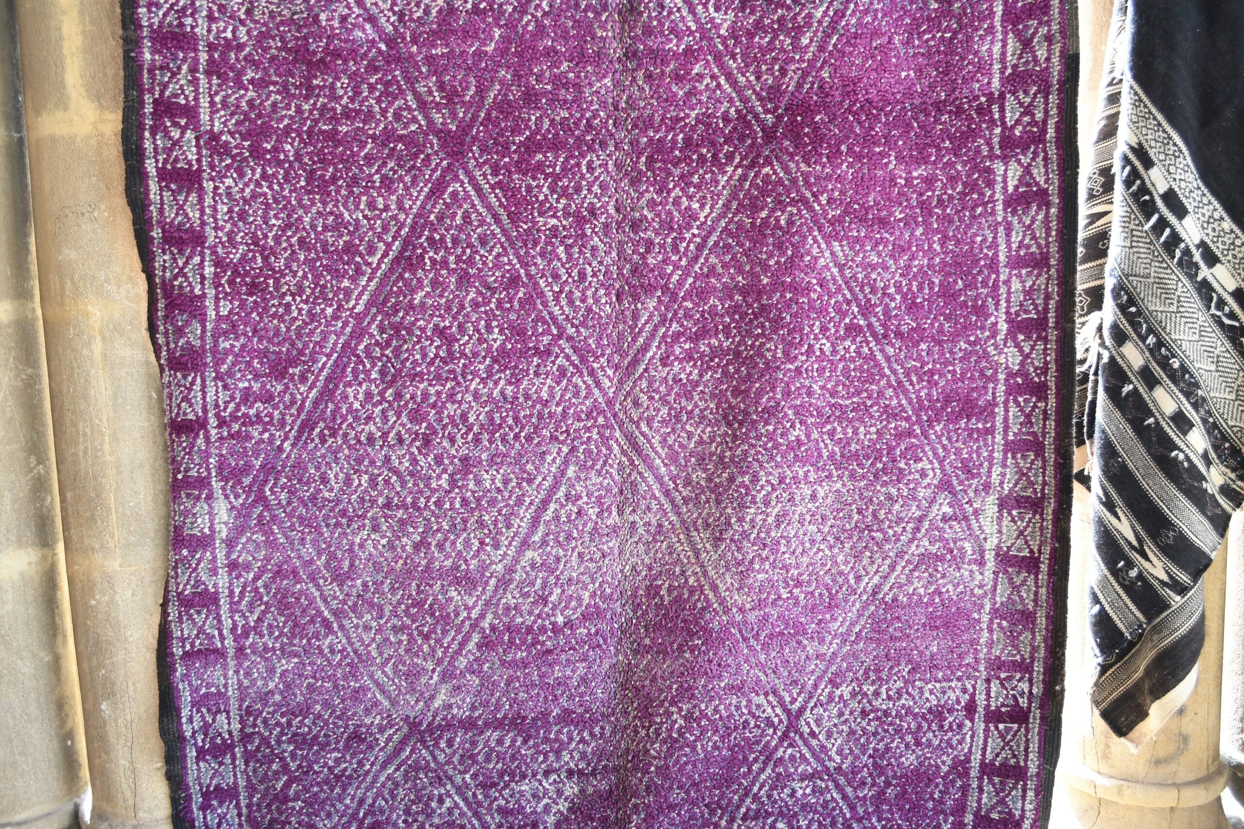 a purple and white rug hanging on a wall. il_fullxfull.6017190526_r74u.jpg