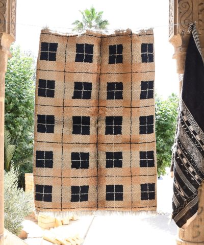 a black and white moroccan rug hanging on a wall. il_fullxfull.6017192030_2e4y.jpg