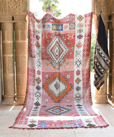 a colorful rug is hanging on a wall. il_fullxfull.6017201602_mssm.jpg