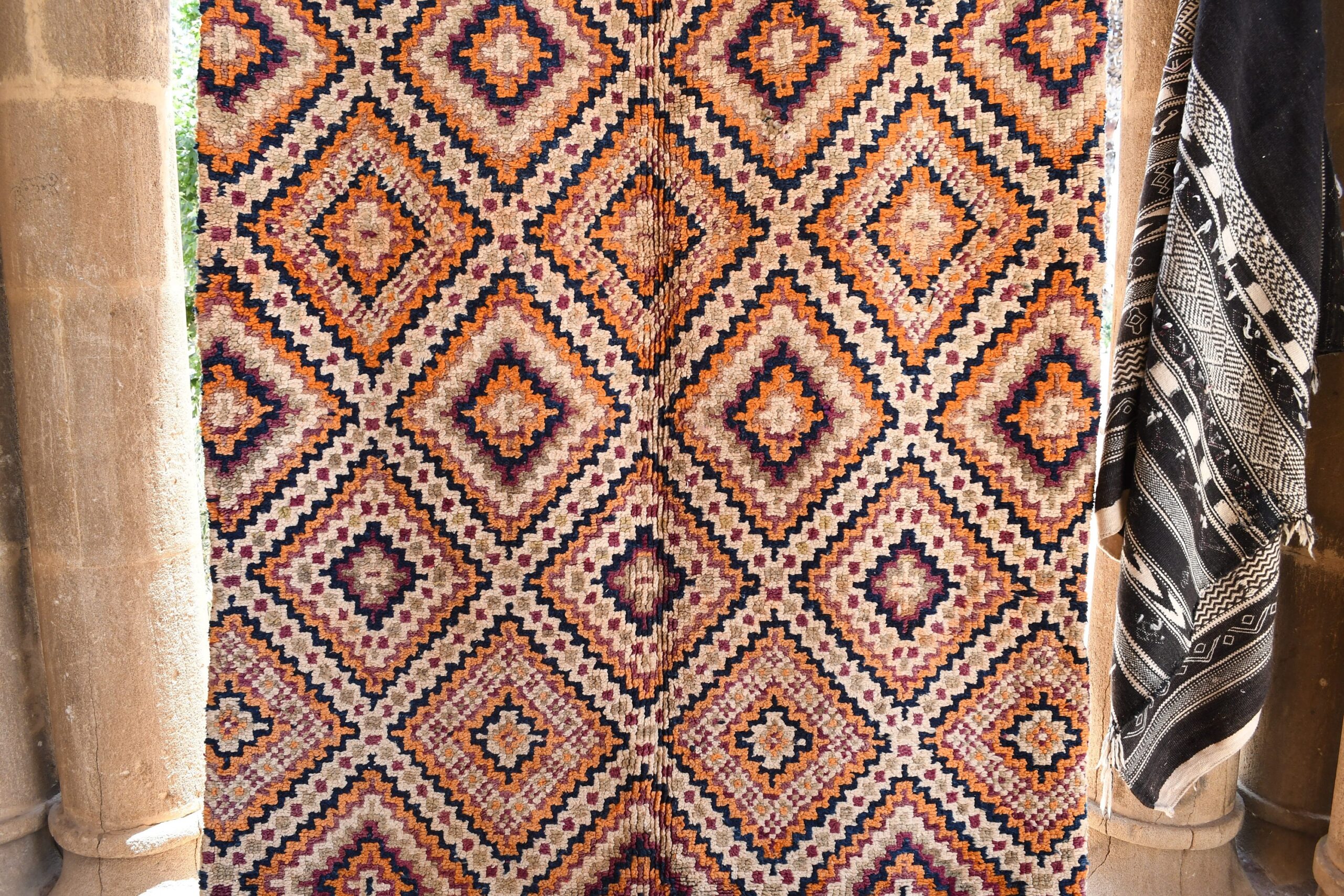 a colorful rug hanging on a wall. il_fullxfull.6017212170_8k13.jpg
