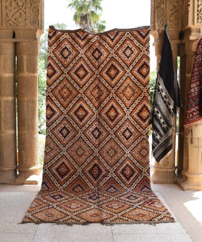 a rug is on display in a room. il_fullxfull.6017212368_pxhy.jpg