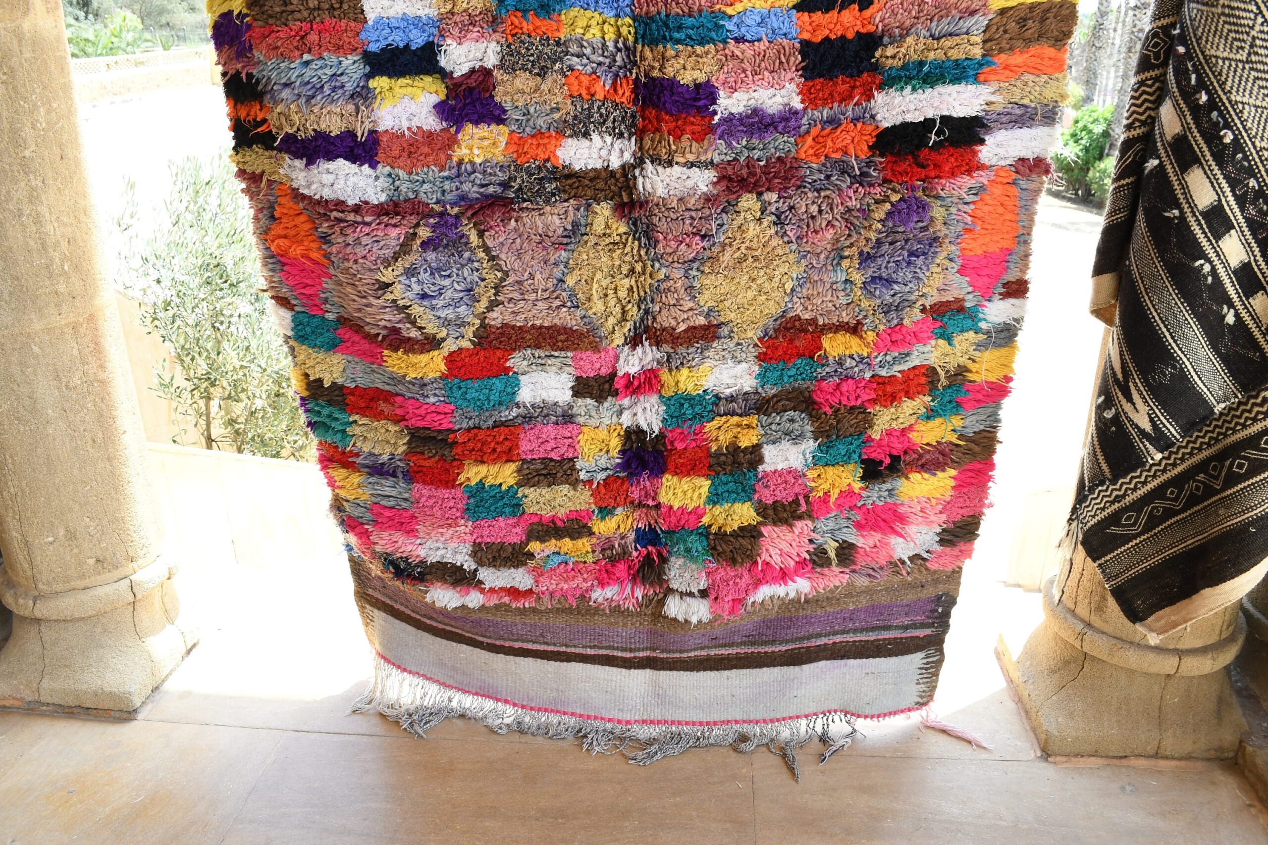 a colorful rug hanging on a wall. il_fullxfull.6017212964_i3ur.jpg