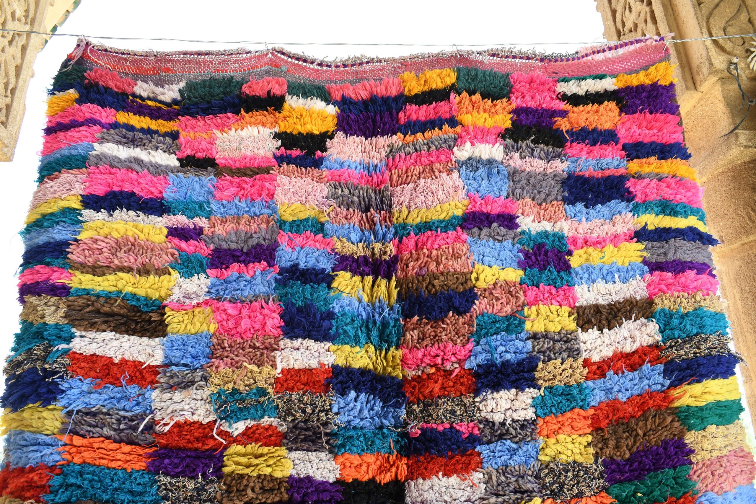a colorful rug hanging on a clothes rack. il_fullxfull.6017213128_lhk0.jpg