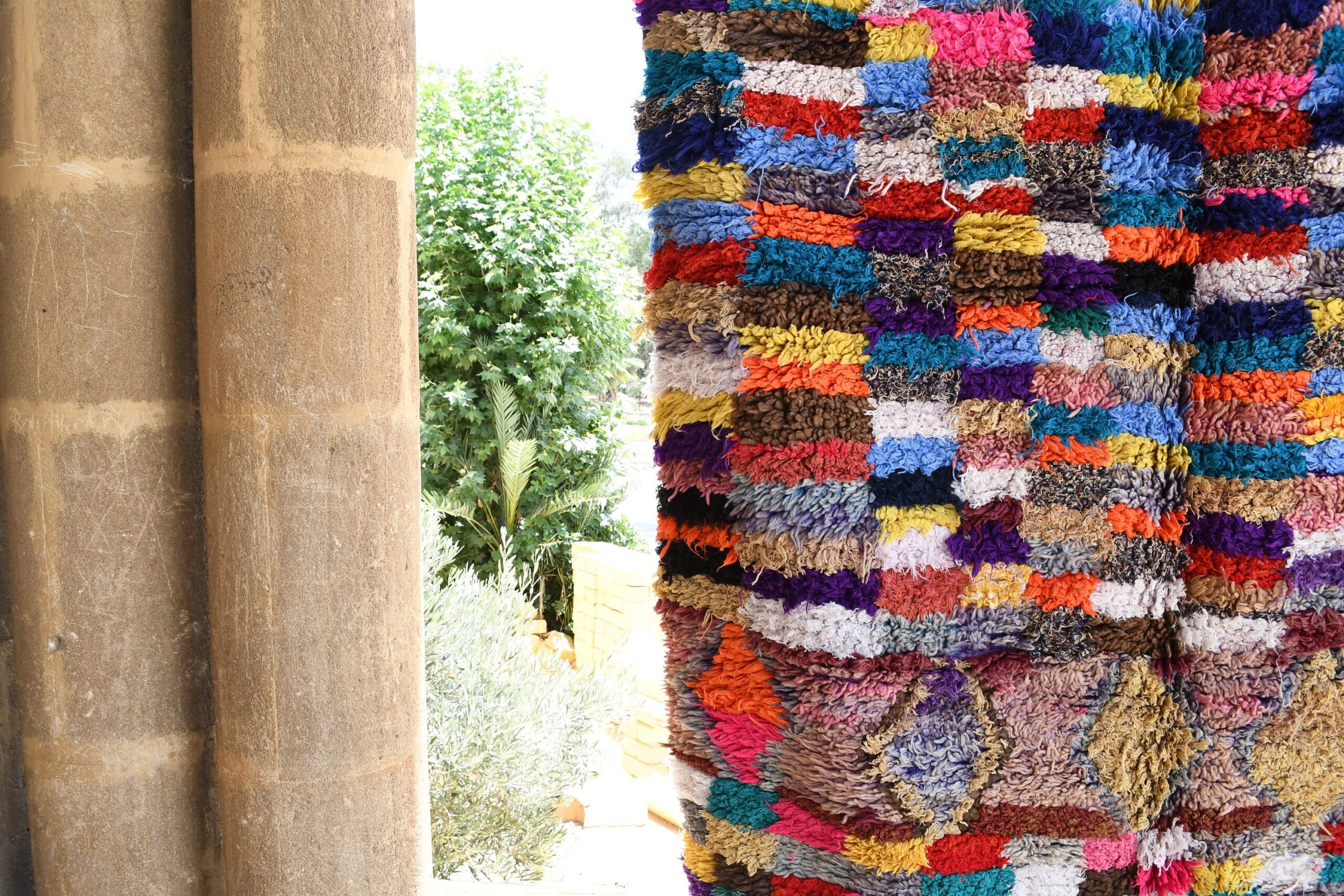 a colorful rug hanging on a wall. il_fullxfull.6017213330_99rb.jpg