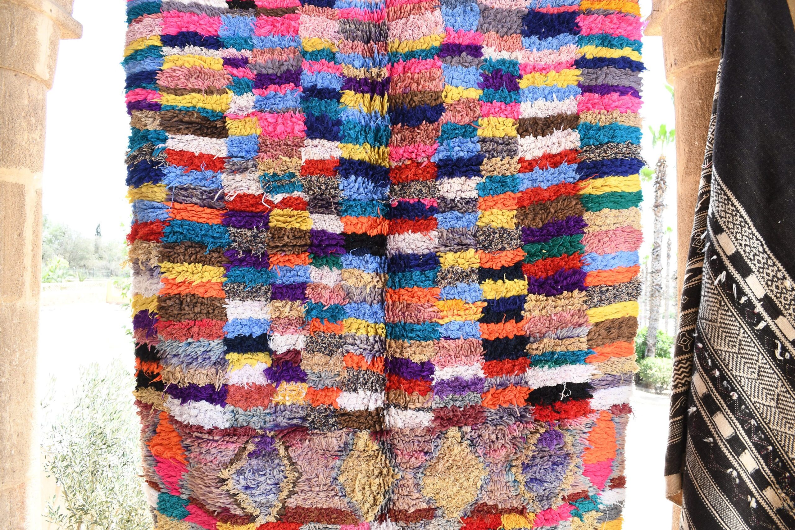 a colorful rug hanging on a wall. il_fullxfull.6017213620_f04p.jpg