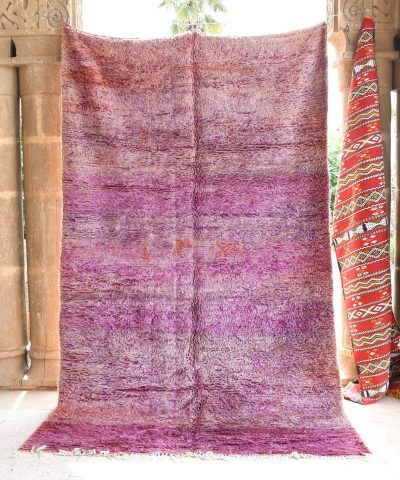 a purple rug is hanging on a wall. il_fullxfull.6017462910_qkjk.jpg