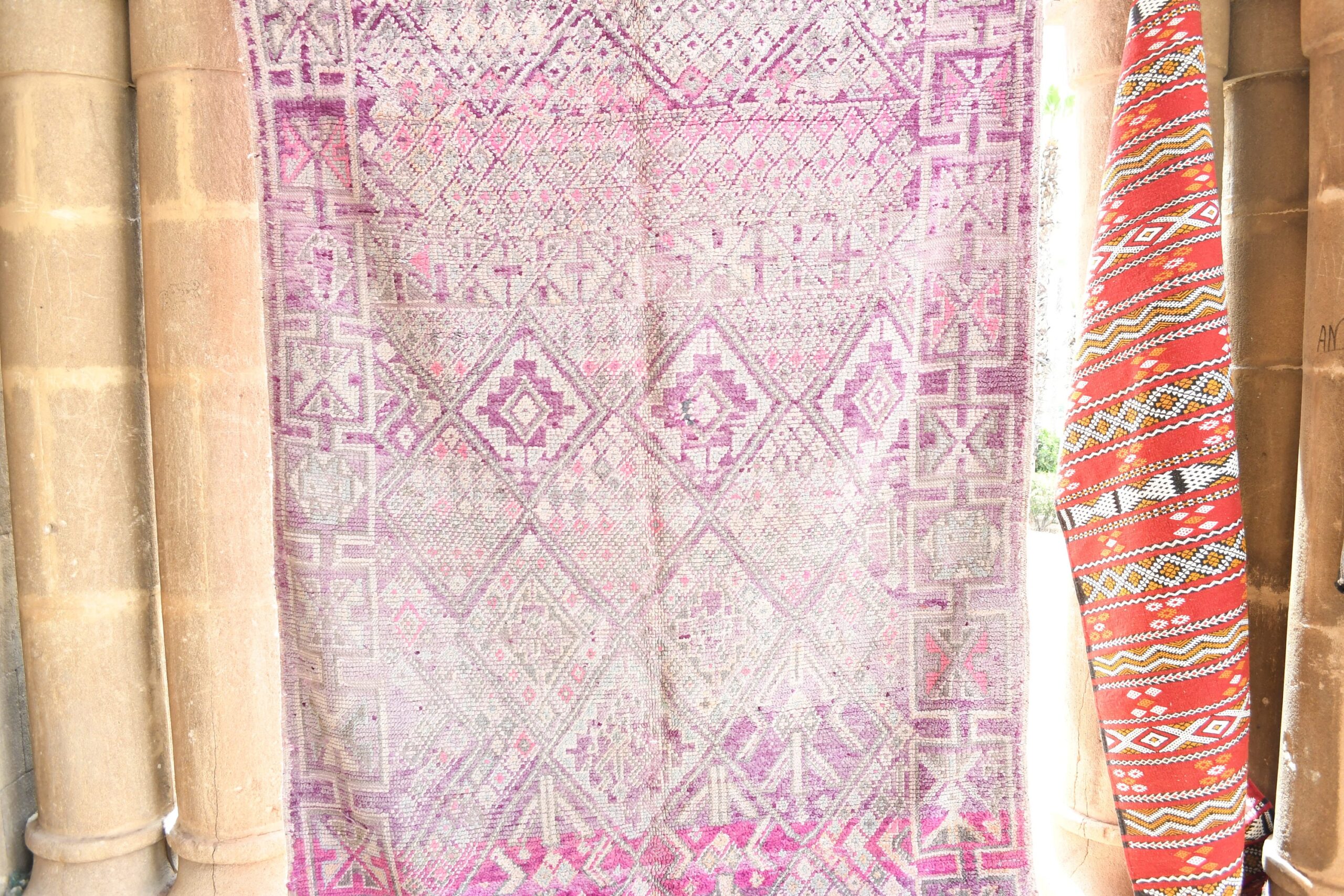 a pink and white rug hanging on a wall. il_fullxfull.6017464128_4mf9.jpg