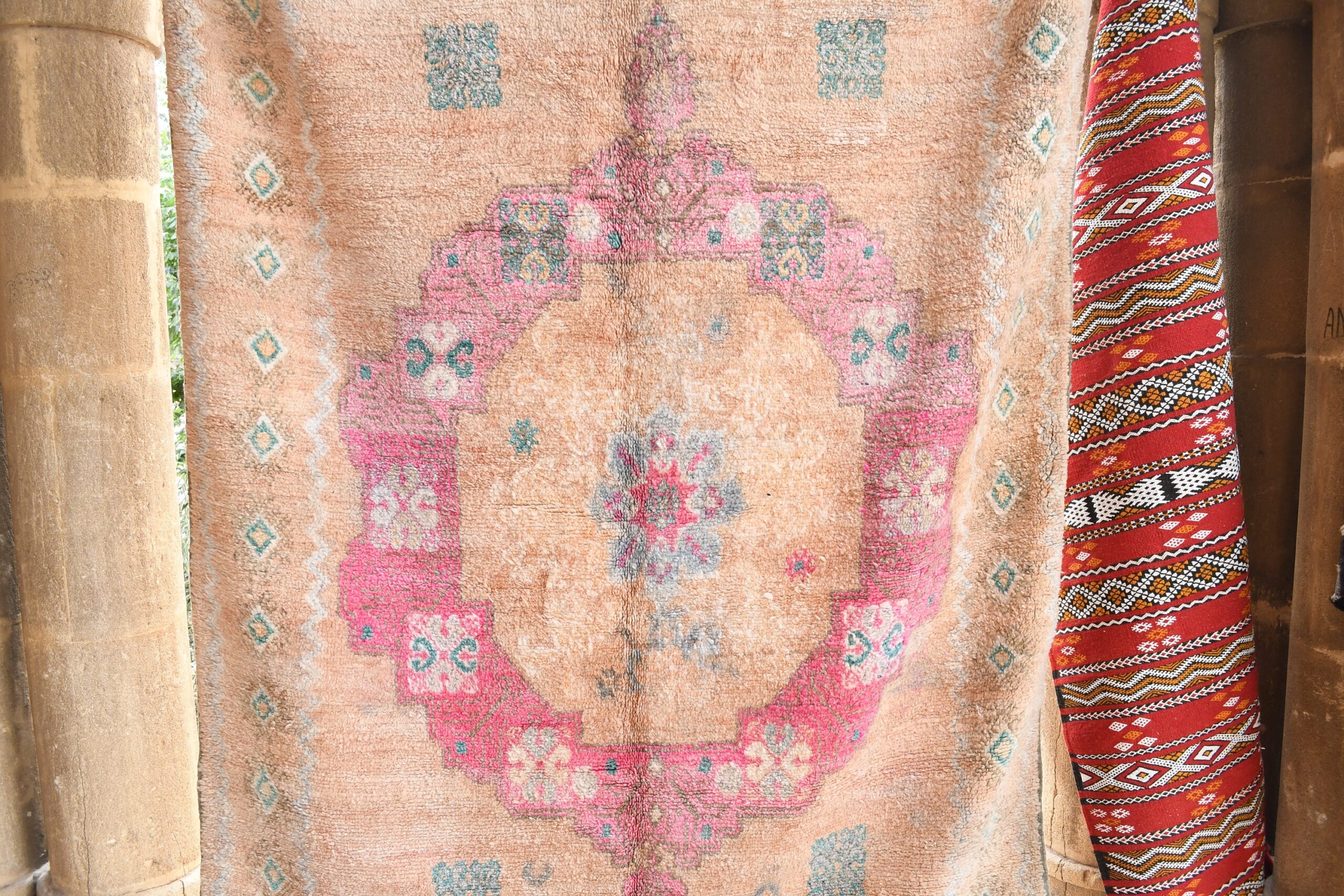 a rug hanging on a wall. il_fullxfull.6017471428_mt9q.jpg