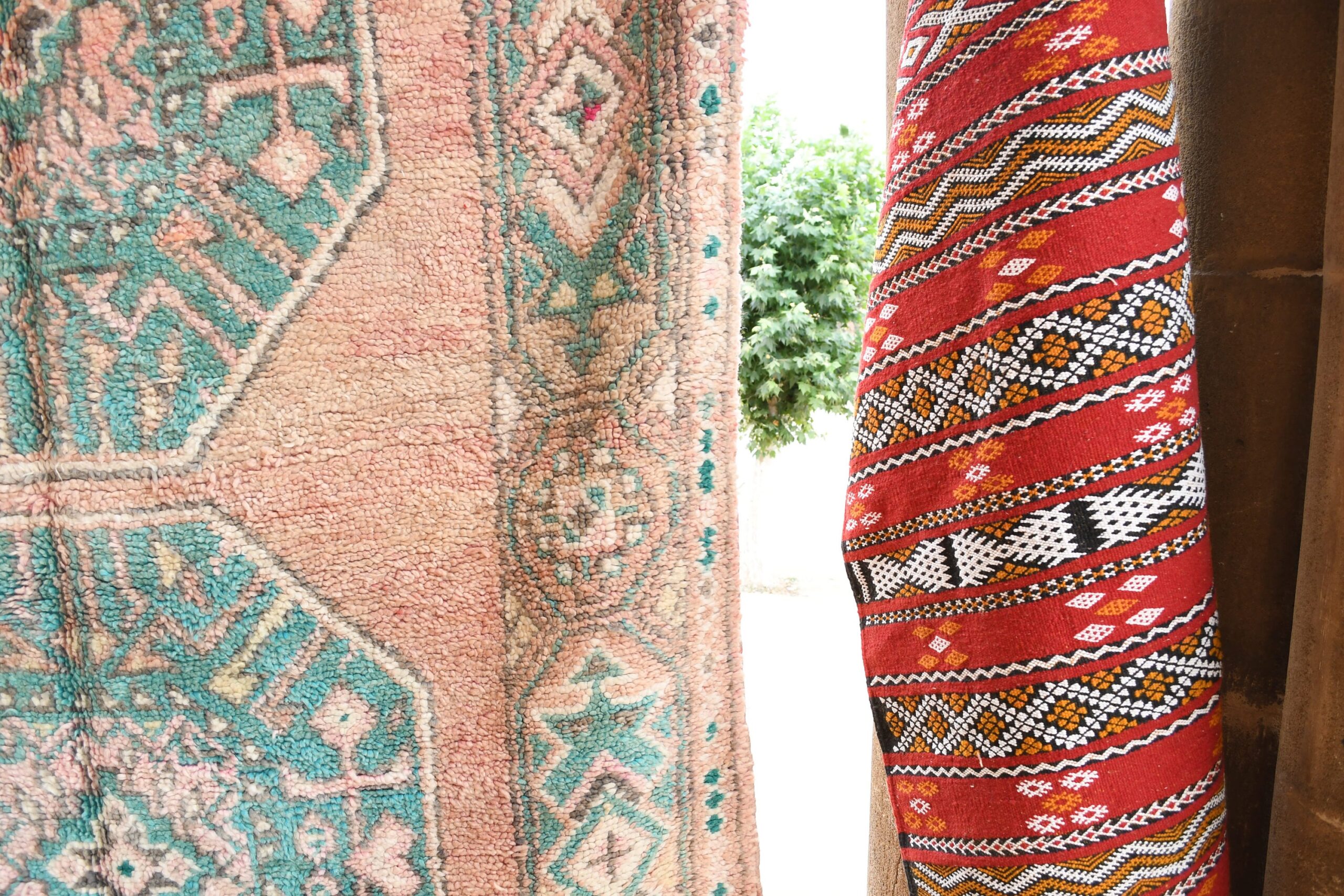 a red and blue rug hanging on a wall. il_fullxfull.6017478108_f84r.jpg