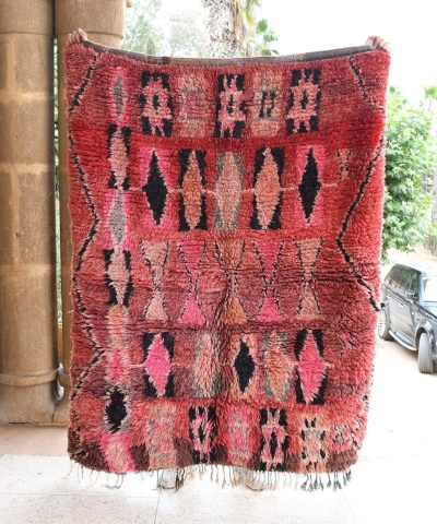 a red rug with black and pink designs. il_fullxfull.6017482138_8bxp.jpg