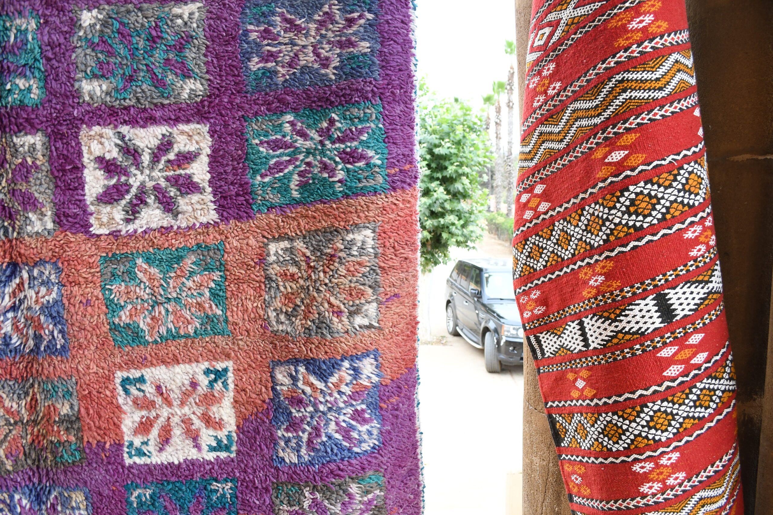 a colorful moroccan rug hanging on a wall. il_fullxfull.6017486832_pwyn.jpg