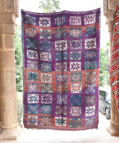 a colorfully colored moroccan rug hanging on a wall. il_fullxfull.6017487250_bjos.jpg