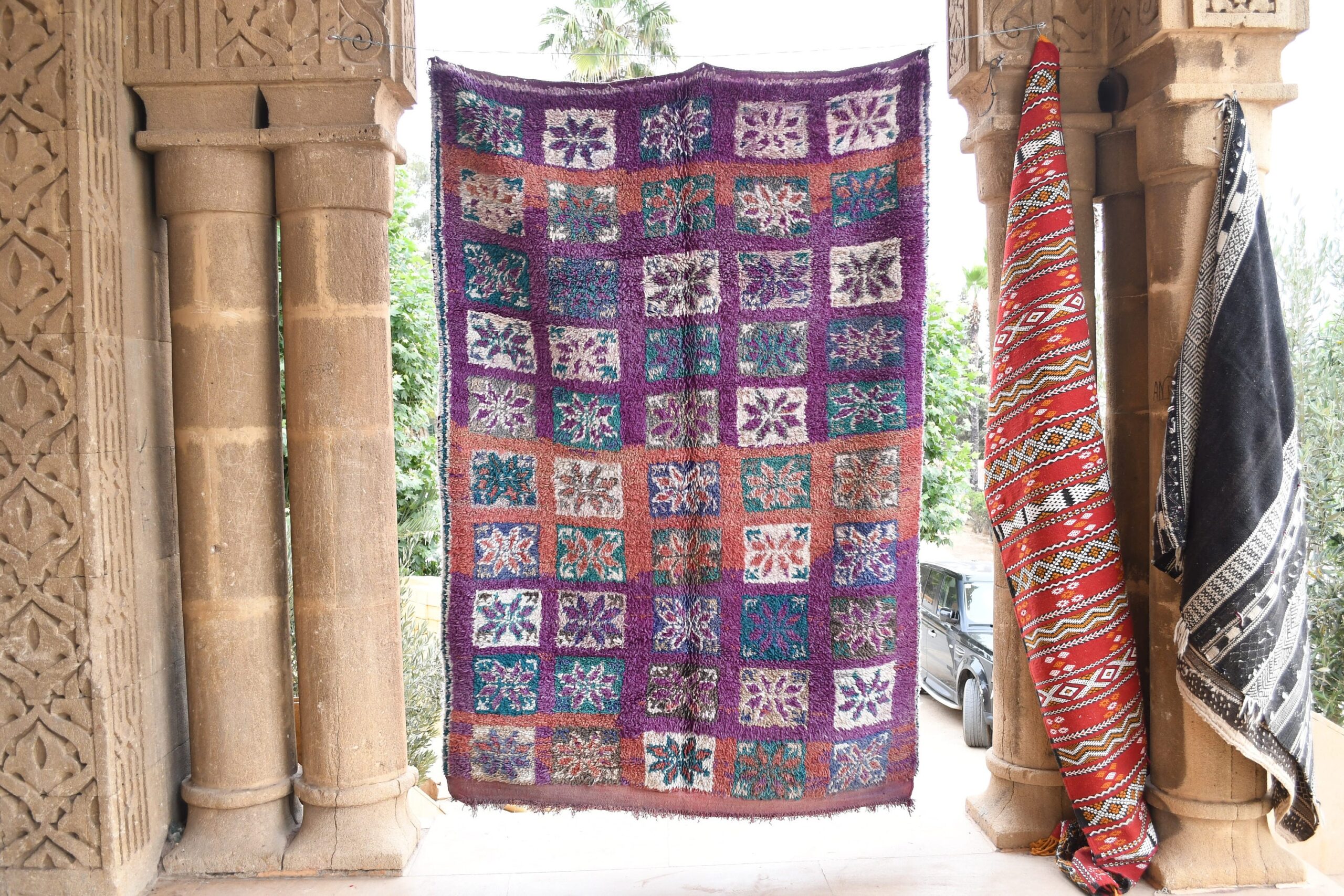 a colorfully colored moroccan rug hanging on a wall. il_fullxfull.6017487250_bjos.jpg