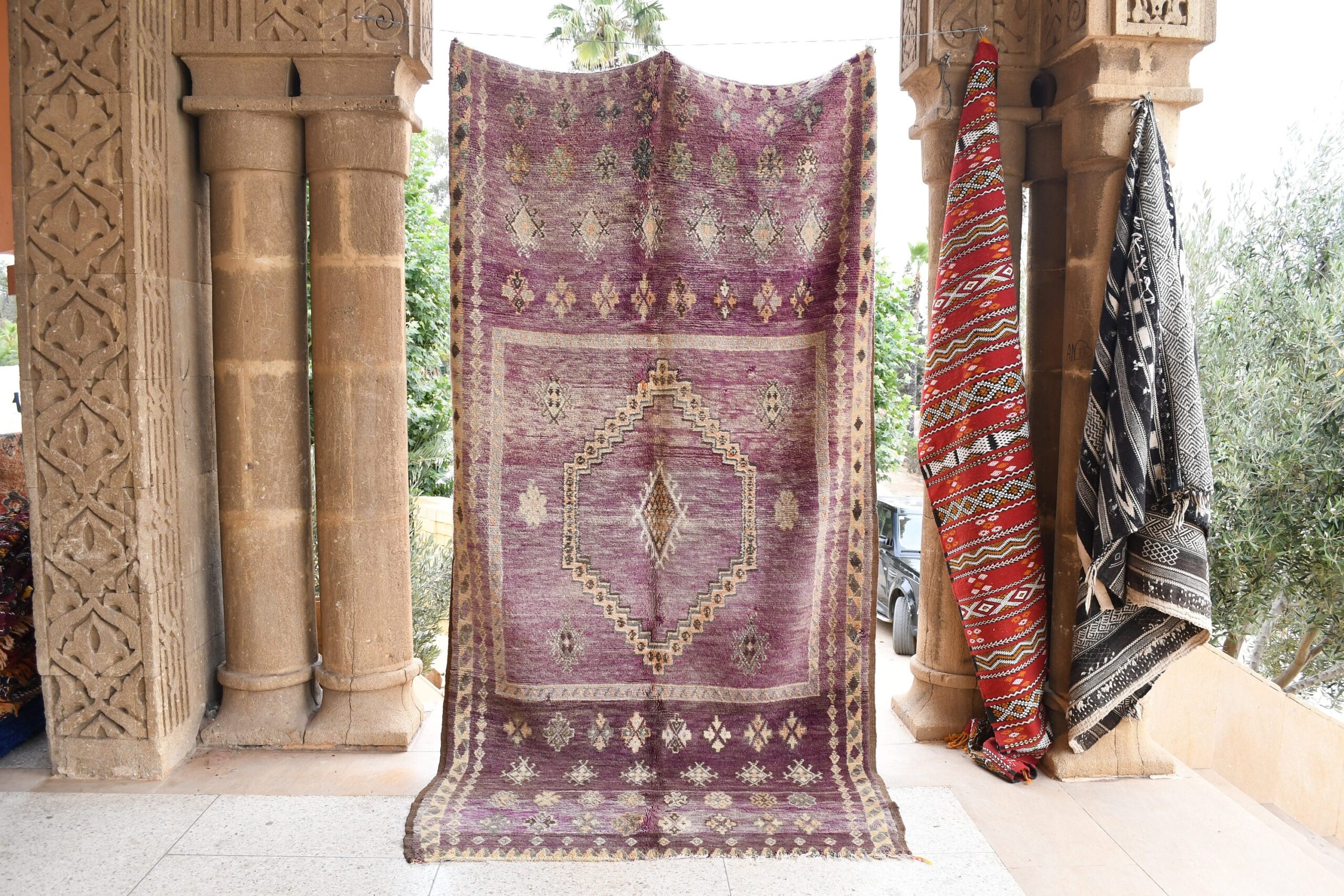 a purple rug hanging on a wall. il_fullxfull.6017500552_tt9y.jpg
