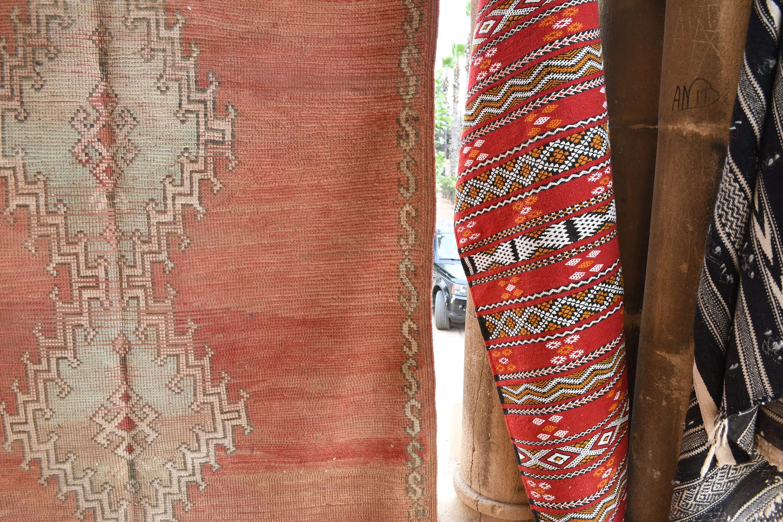 a red rug with a pattern. il_fullxfull.6017501376_bnzm.jpg