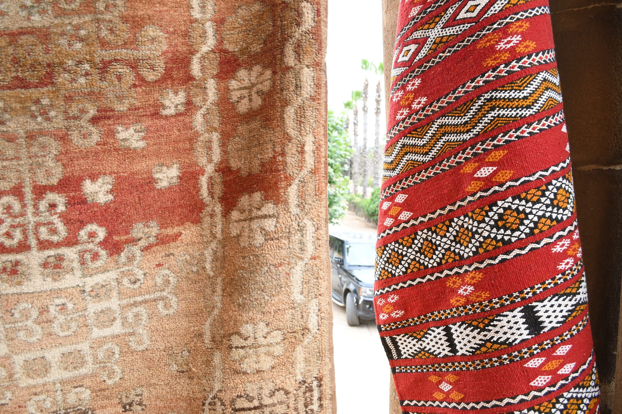 a red and white moroccan rug hanging on a wall. il_fullxfull.6017503560_4x3w.jpg