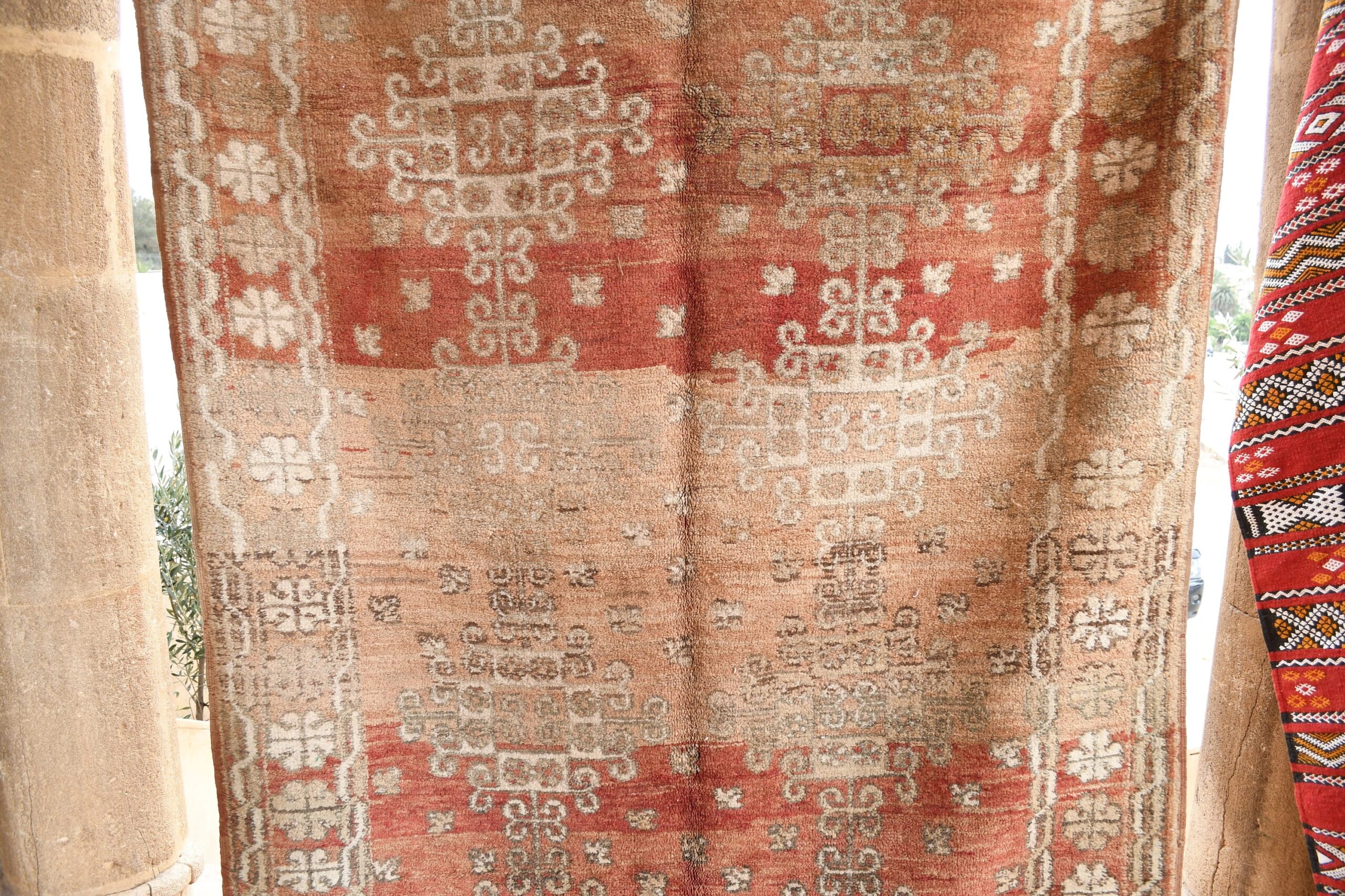 a red rug with a pattern on it. il_fullxfull.6017503822_5l91.jpg