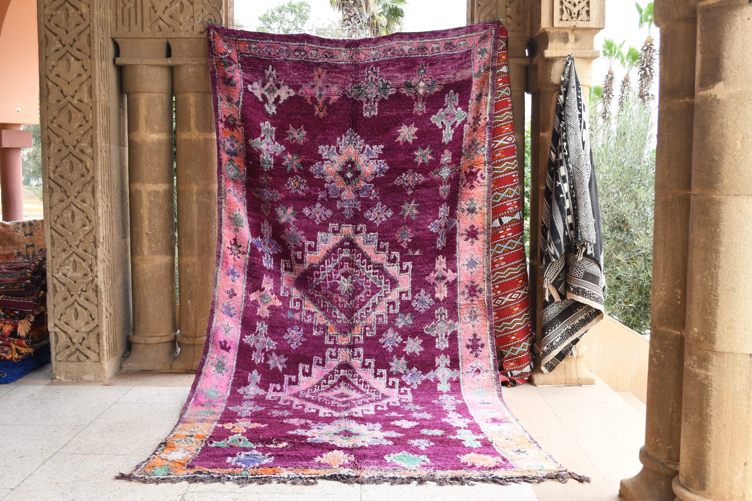 a purple rug with a floral design on it. il_fullxfull.6017504988_8w0b.jpg