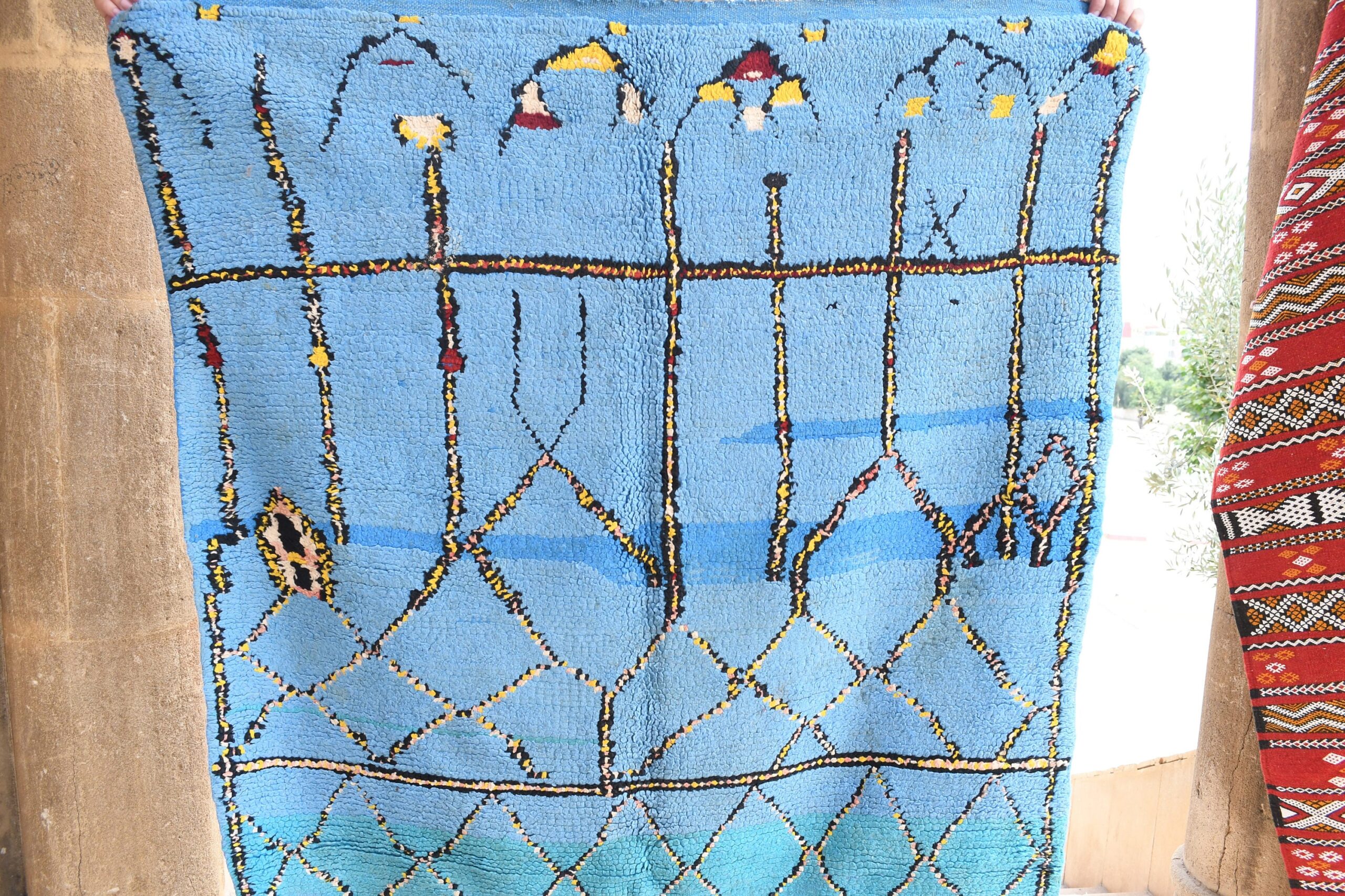 a blue rug with a pattern of birds and flowers. il_fullxfull.6017510588_f24s.jpg