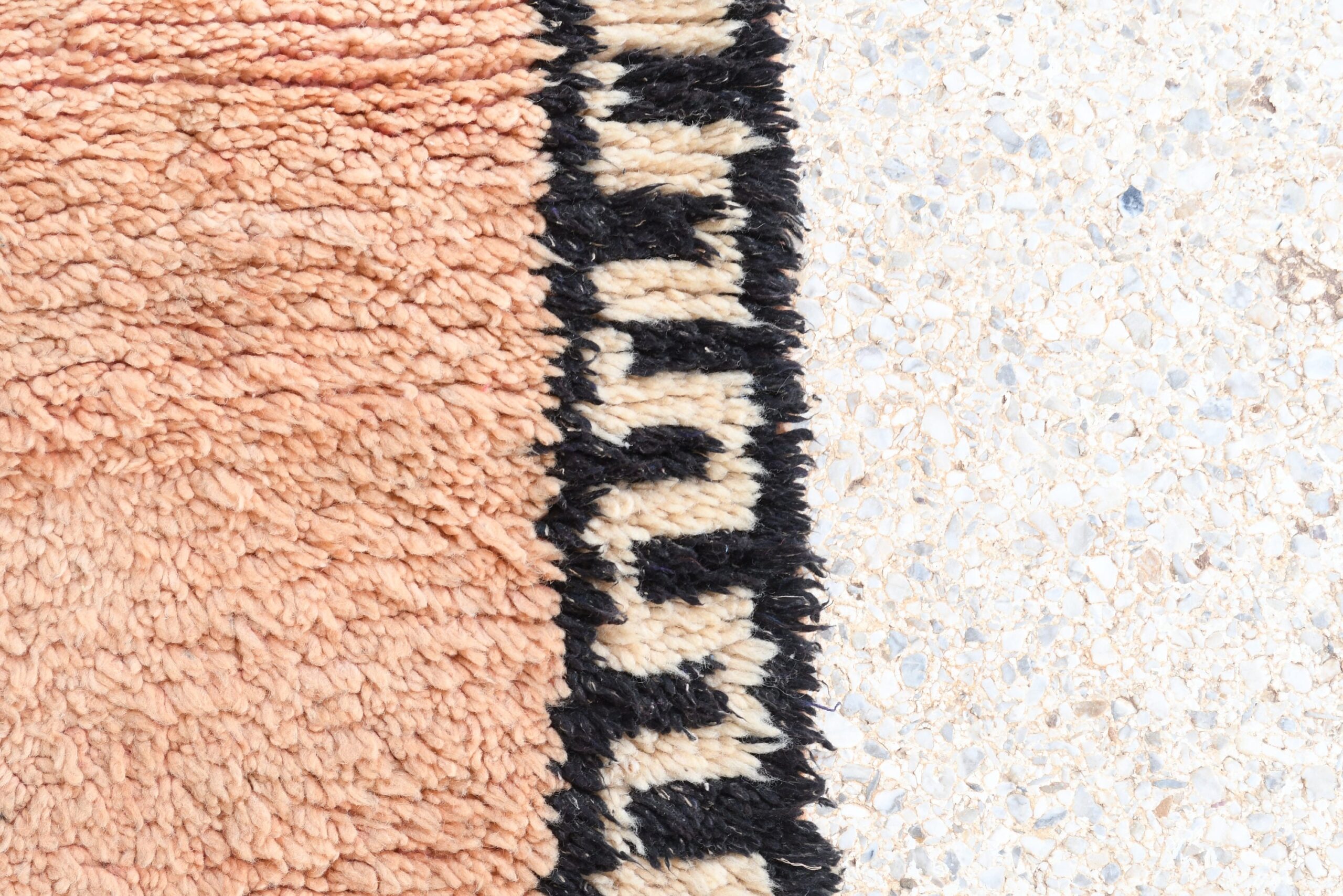 a rug with a black and white stripe. il_fullxfull.6017516228_q6ib.jpg