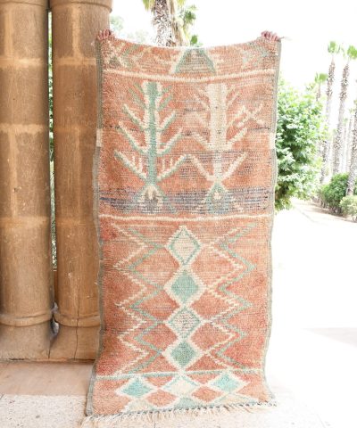 a woman sitting on a bench next to a tall pillar. il_fullxfull.6017518912_e77e.jpg