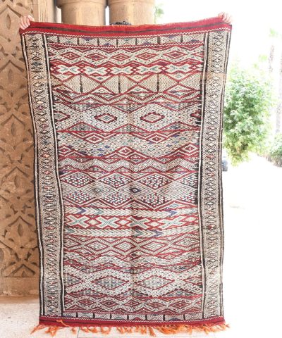 a large rug with a red and white design. il_fullxfull.6017569668_zpwk.jpg