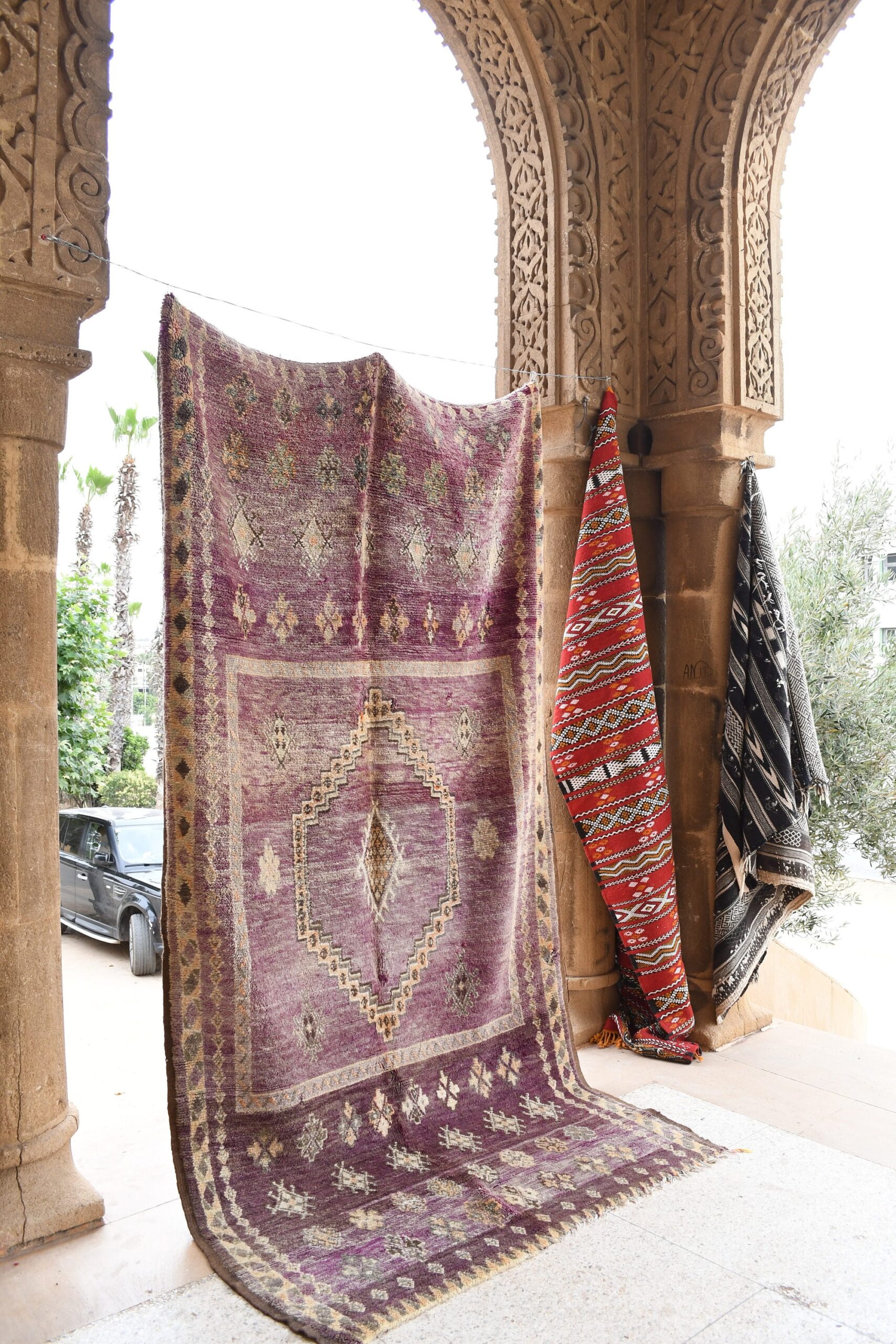 a purple rug hanging on a wall. il_fullxfull.6021328882_gctp.jpg