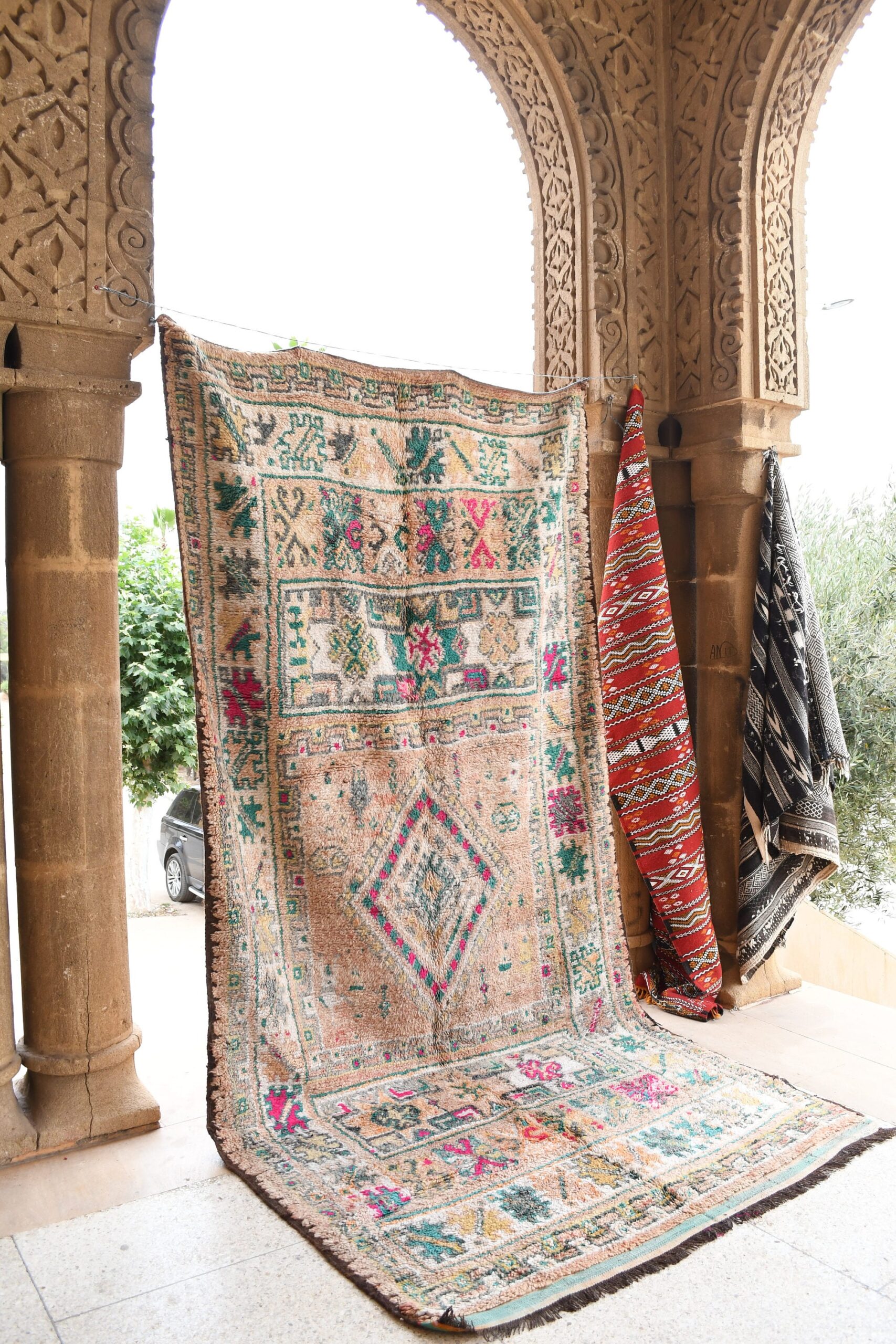 a rug is hanging on a wall. il_fullxfull.6021375918_60b8.jpg