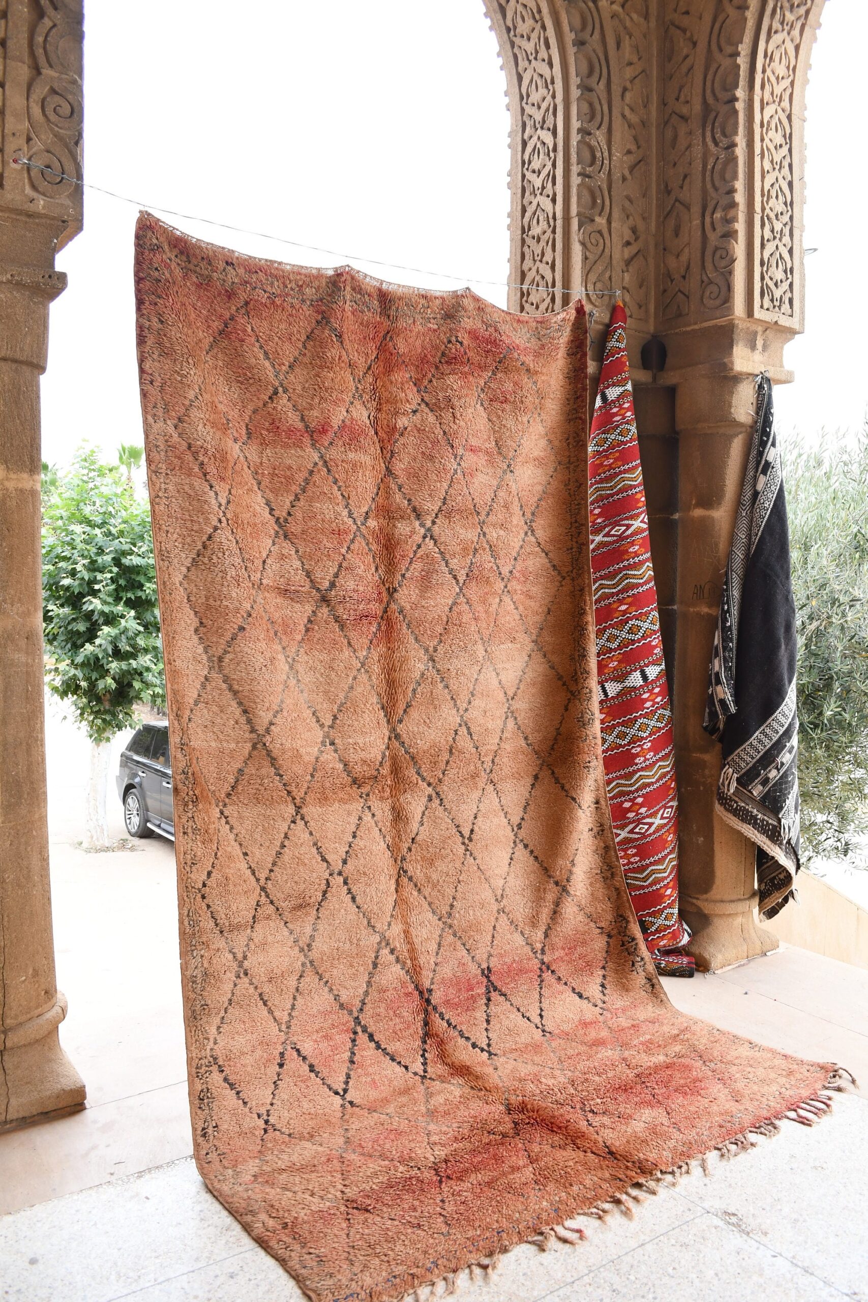 a rug is hanging on a wall. il_fullxfull.6021407326_rkvk.jpg