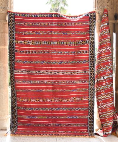 a red and black rug hanging on a wall. il_fullxfull.6023061530_e1zd.jpg