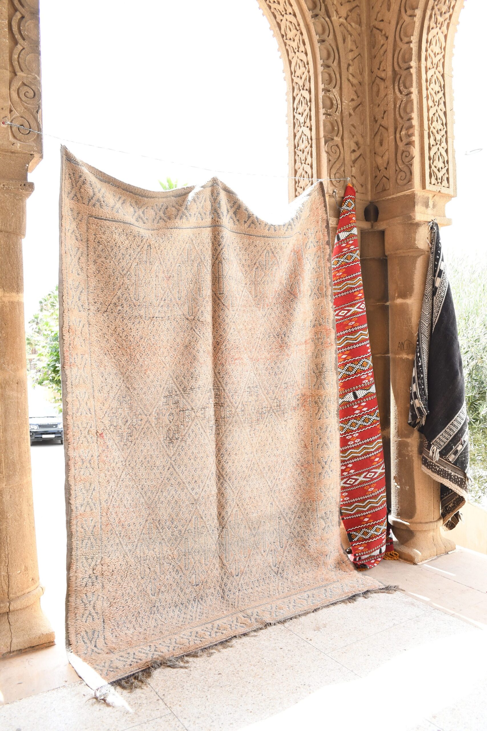 a man is standing in a doorway with a rug. il_fullxfull.6023096260_m8xr.jpg