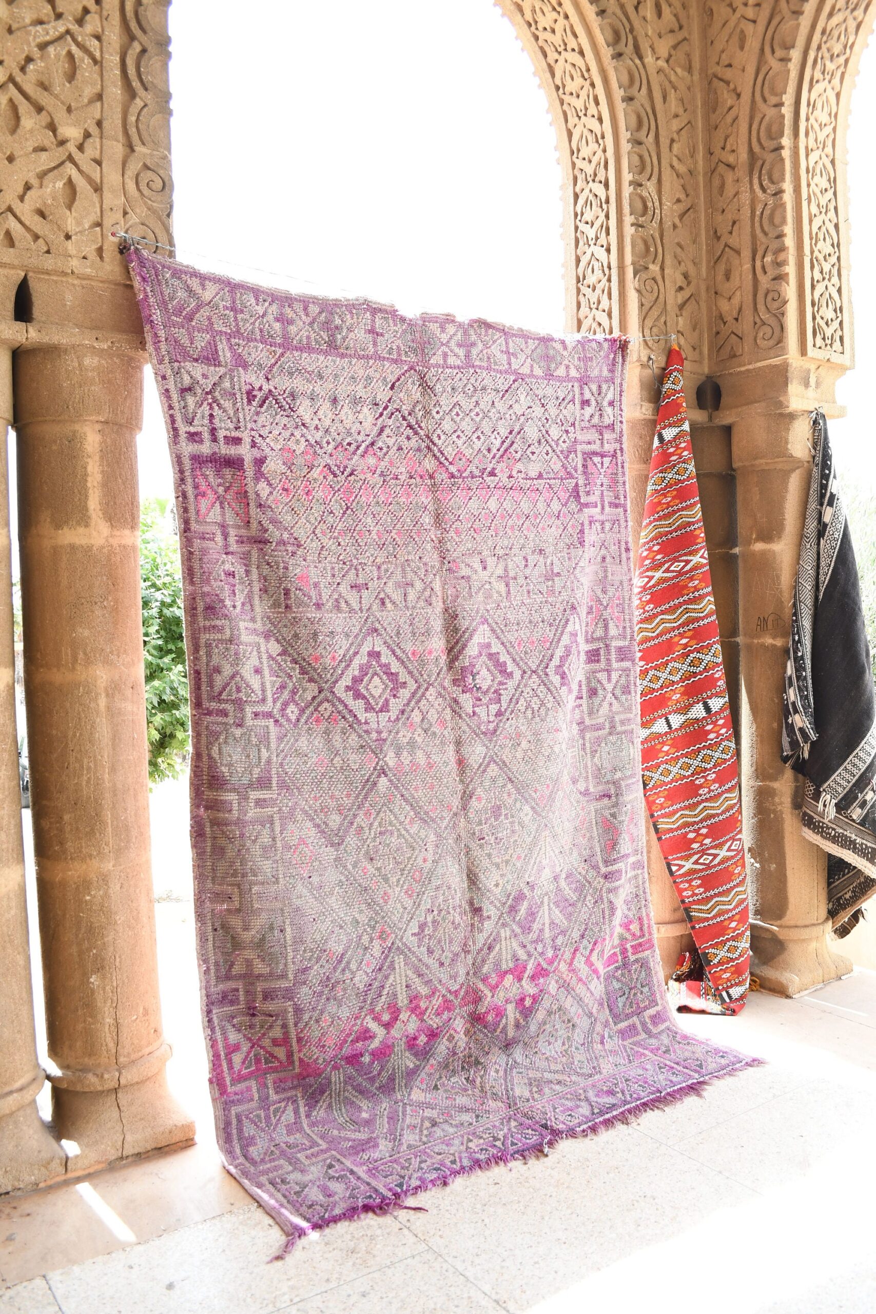 a woman is sitting on a bench in a building. il_fullxfull.6023097220_5rec.jpg