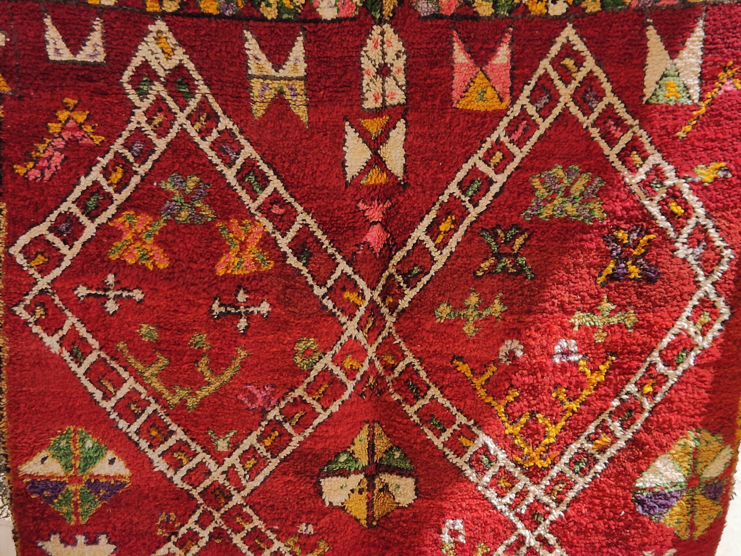 a red rug with a pattern on it. il_fullxfull.6023099732_85xo.jpg