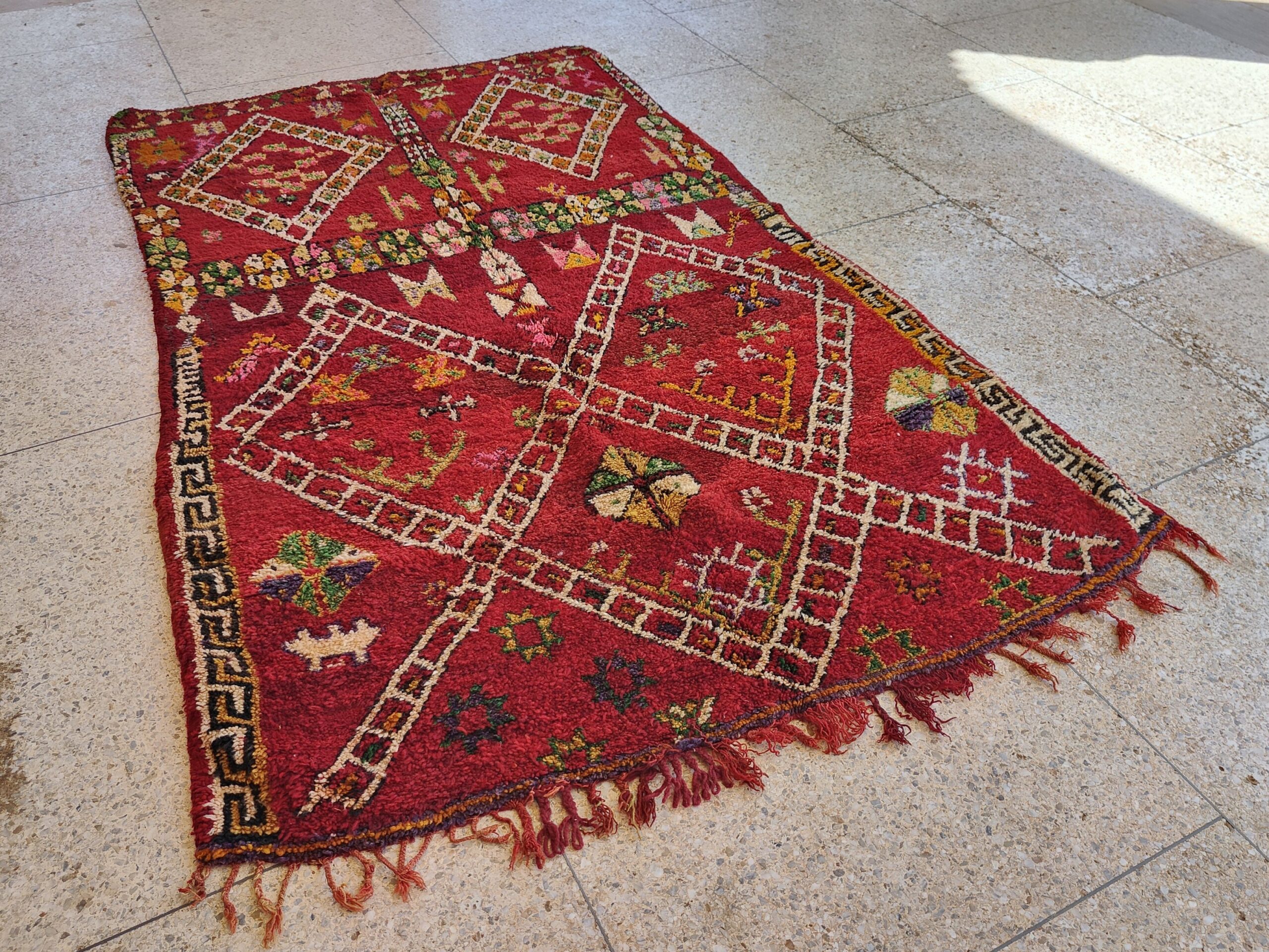 a red rug with a pattern on it. il_fullxfull.6023099756_7xfe.jpg