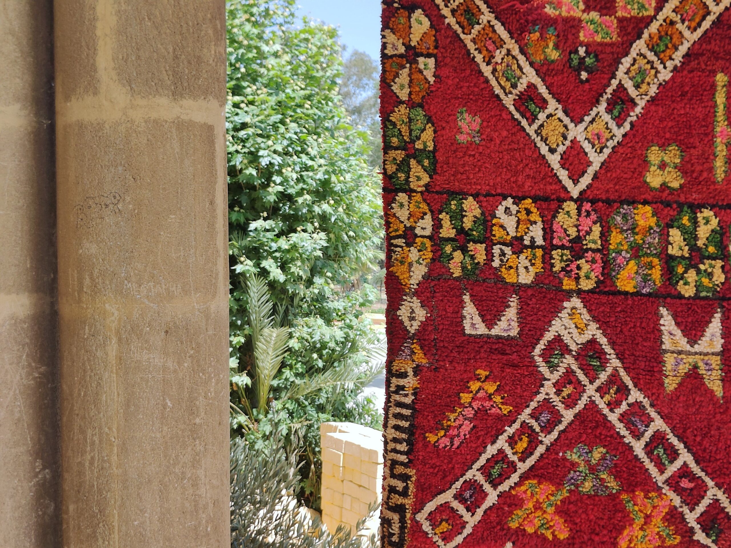 a red rug with a pattern on it. il_fullxfull.6023099862_tp97.jpg