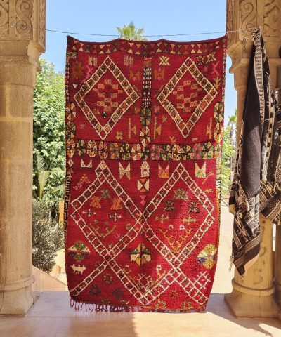 a red rug hanging on a wall. il_fullxfull.6023101332_2ryv.jpg